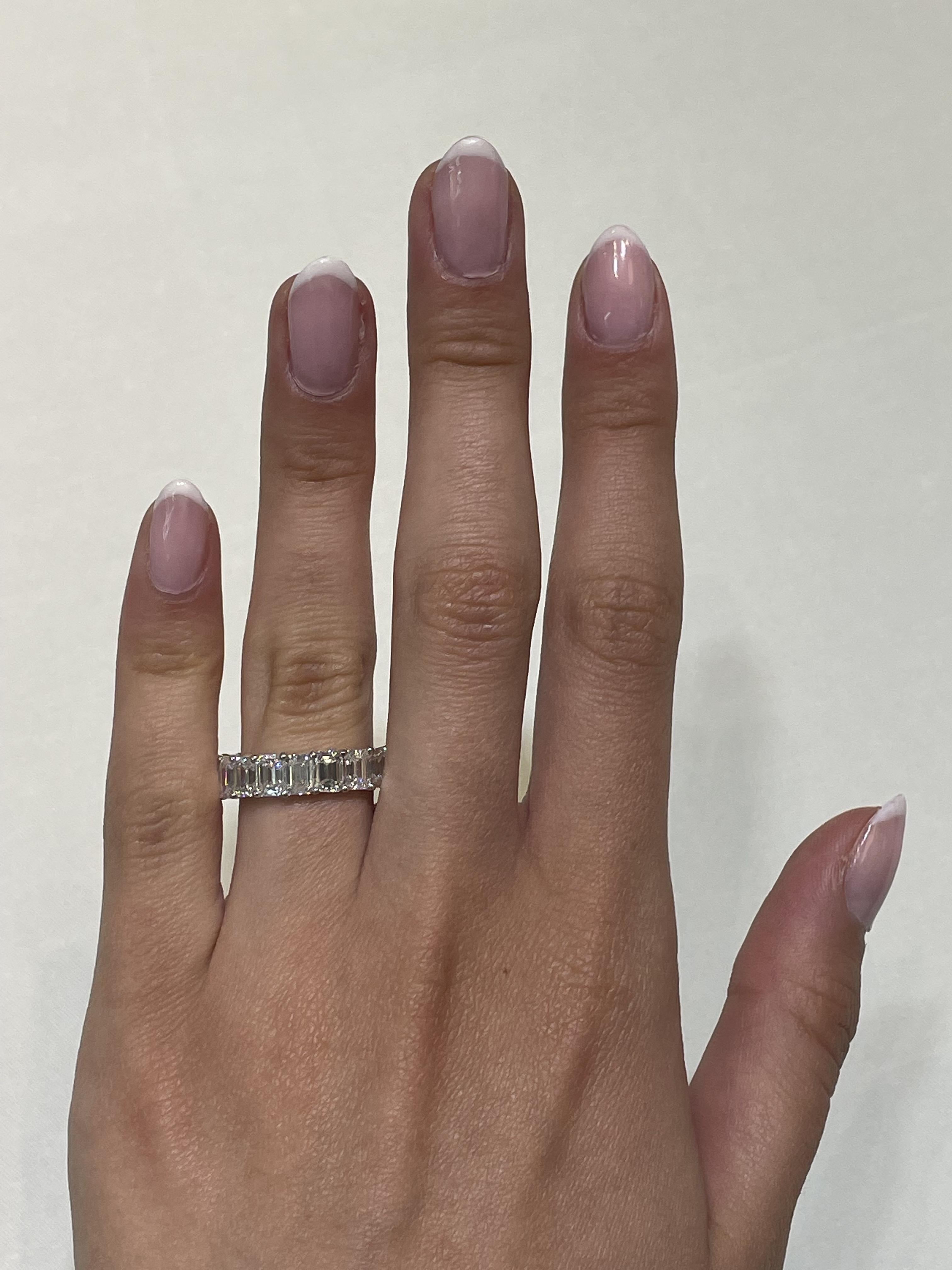 Stunning emerald cut diamond eternity band, by Alexander Beverly Hills.
19 emerald cut diamonds, 7.32 carats total. Approximately G color and VS1 clarity. 4 prong set in 18-karat white gold, 3.30 grams, size 6.
Accommodated with an up to date