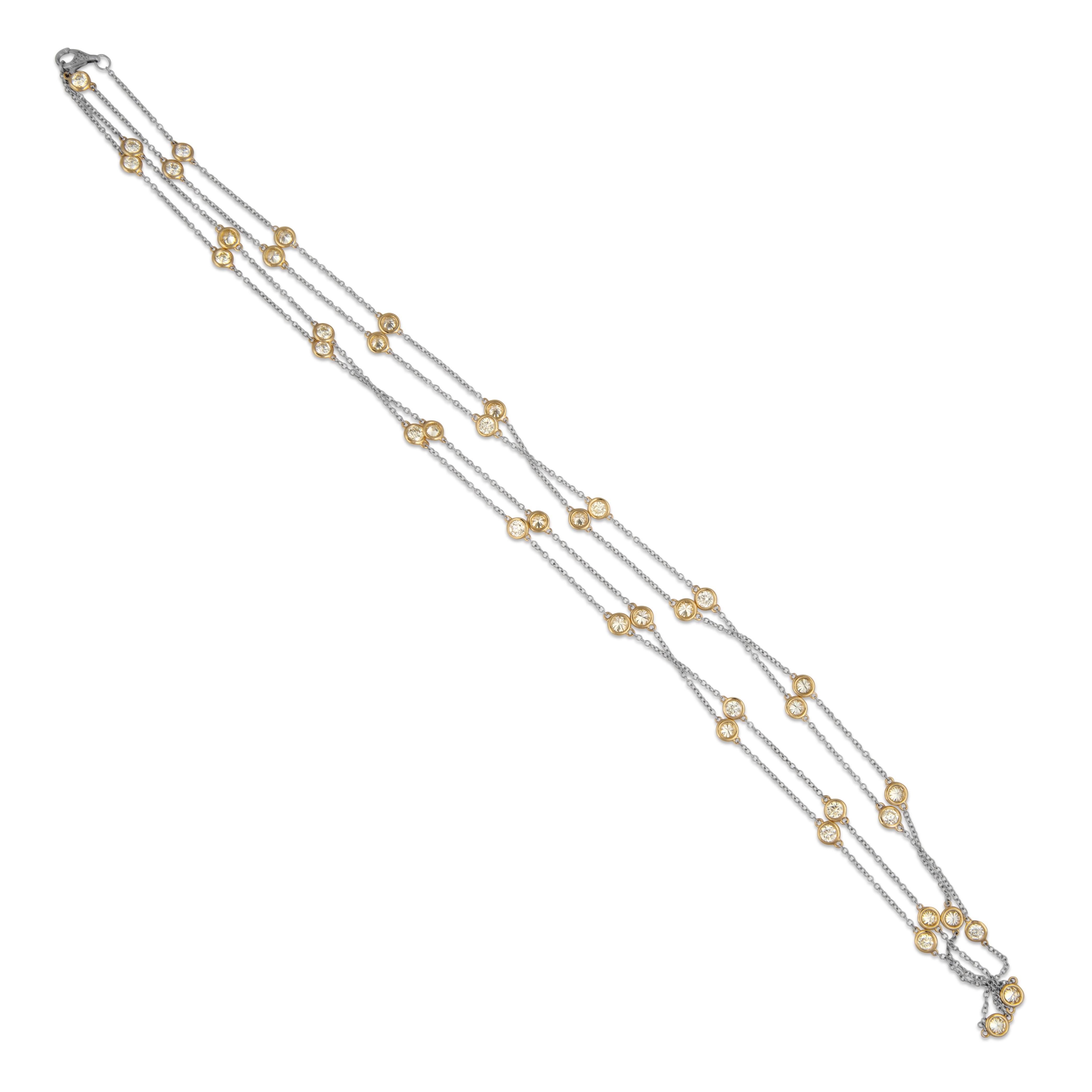 Exquisite round brilliant diamonds by the yard modern necklace. By Alexander Beverly Hills.
51 round brilliant diamonds, 8.34 carats total. Approximately I/J color and VS1-SI1 clarity. Bezel set in two tone 18k white  and yellow gold, 15.27 grams,