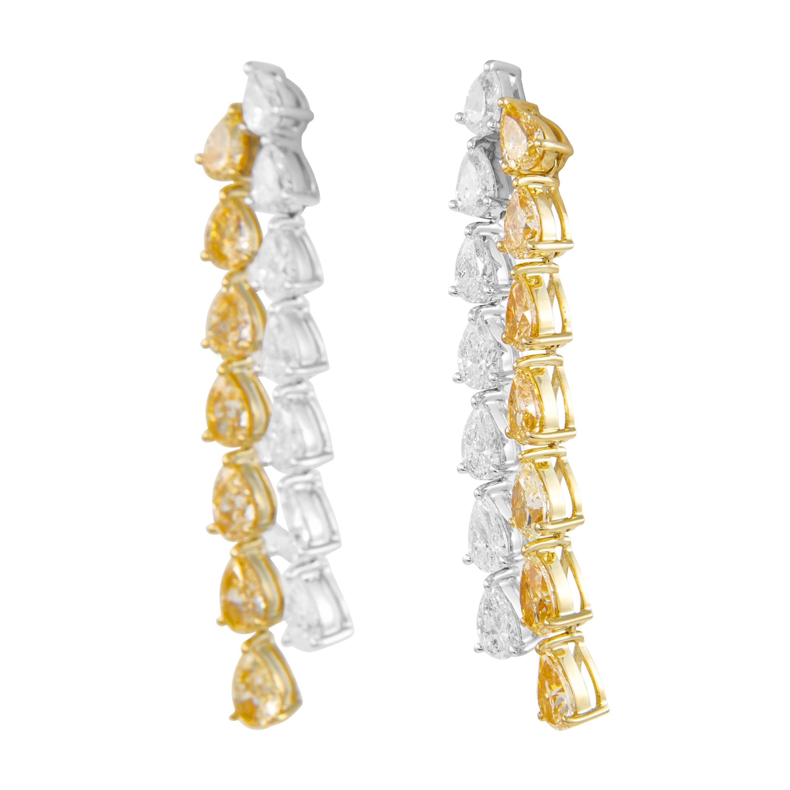 Stunning pear shape fancy yellow diamond with oval diamond drop earrings. High jewelry by Alexander Beverly Hills.
8.66 carats total diamond weight.
*Fancy yellow diamonds look fancy intense in the mounting.
14 pear shape diamonds, 5.14 carats.