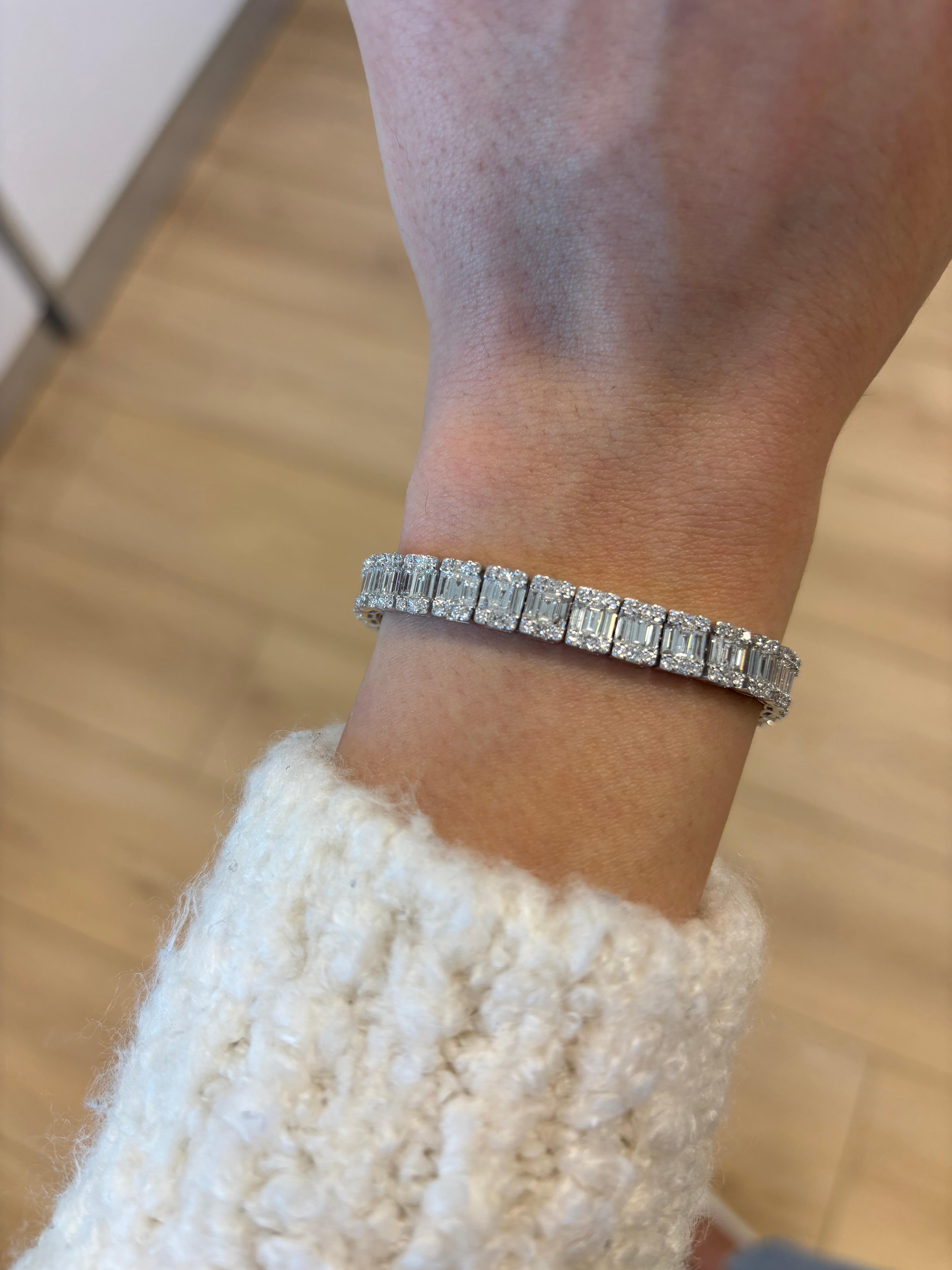 Sensational modern round and baguette 18k white gold bracelet.. By Alexander Beverly Hills.
315 round, baguette, and princess cut diamonds, 4.85 carats. Approximately G/H color and SI clarity. 18k white gold, 22.87 grams, 7 inches.
Accommodated with