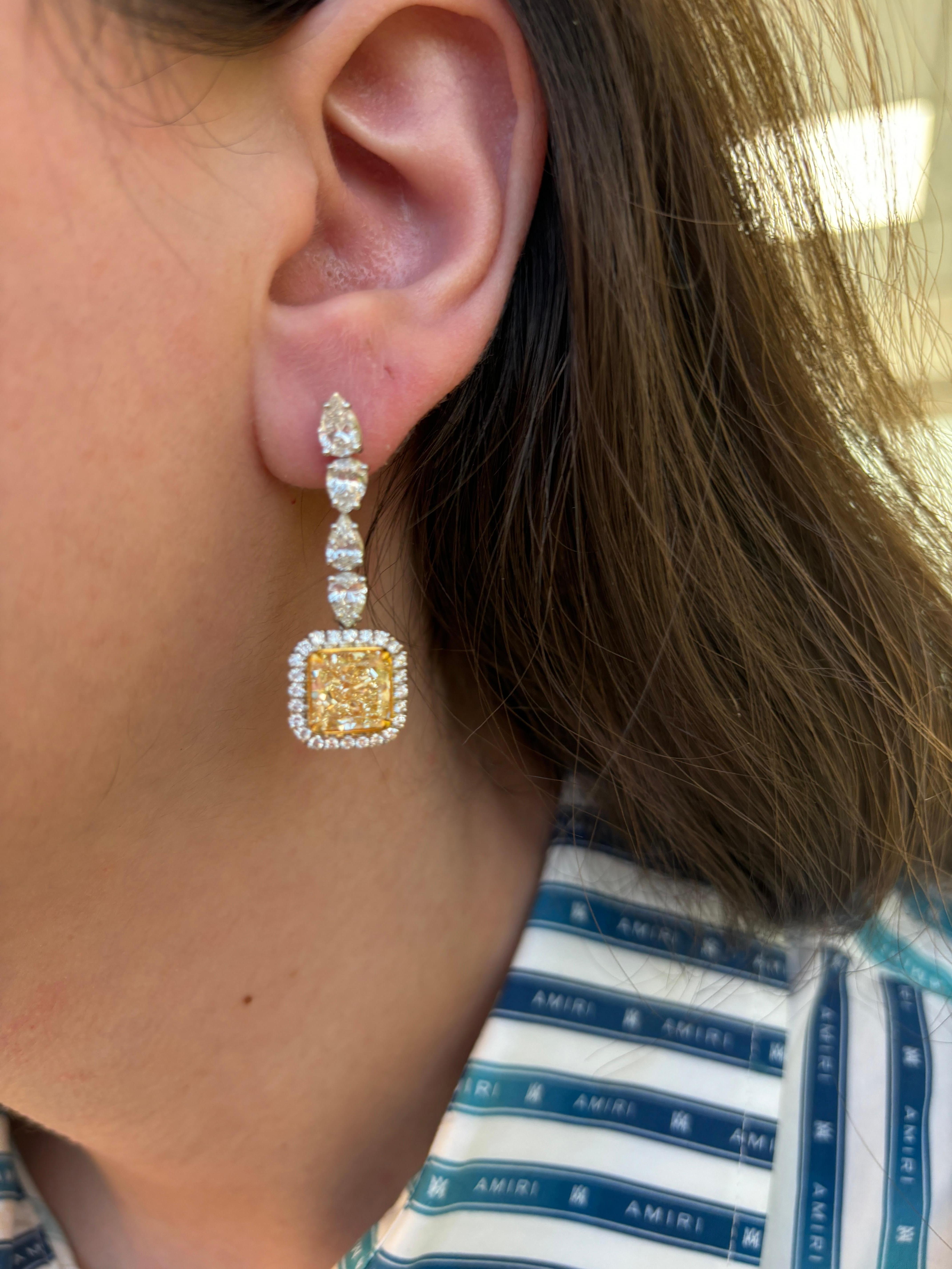 Stunning yellow diamond drop earrings with pear shape diamonds and halo, EGL certified. High jewelry by Alexander Beverly Hills.  
9.20 carats total diamond weight.
2 radiant cut diamonds, 6.19 carats. Both Fancy Yellow color and VVS2 clarity grade,
