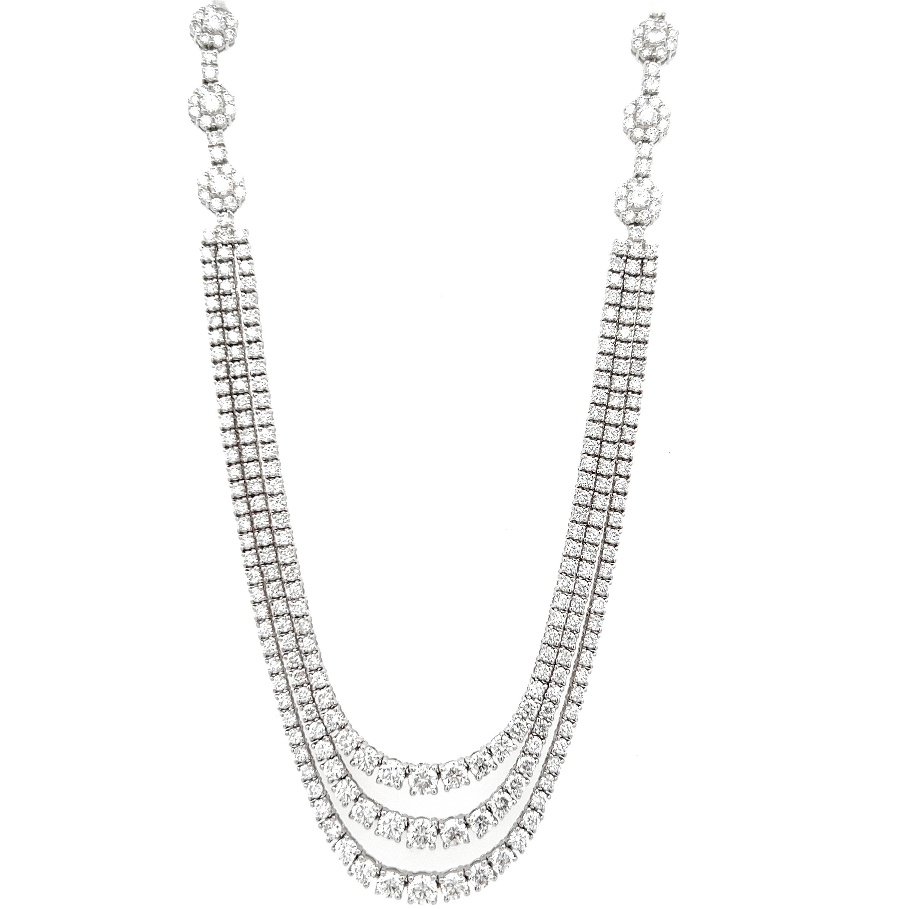 Beautiful and classic diamond three-row tennis necklace with motif. By Alexander Beverly Hills.
285 round brilliant diamonds, 9.21ct. Approximately F/G color and VS clarity. 18k white gold, 29.18 grams, 17in.
Accommodated with an up-to-date digital