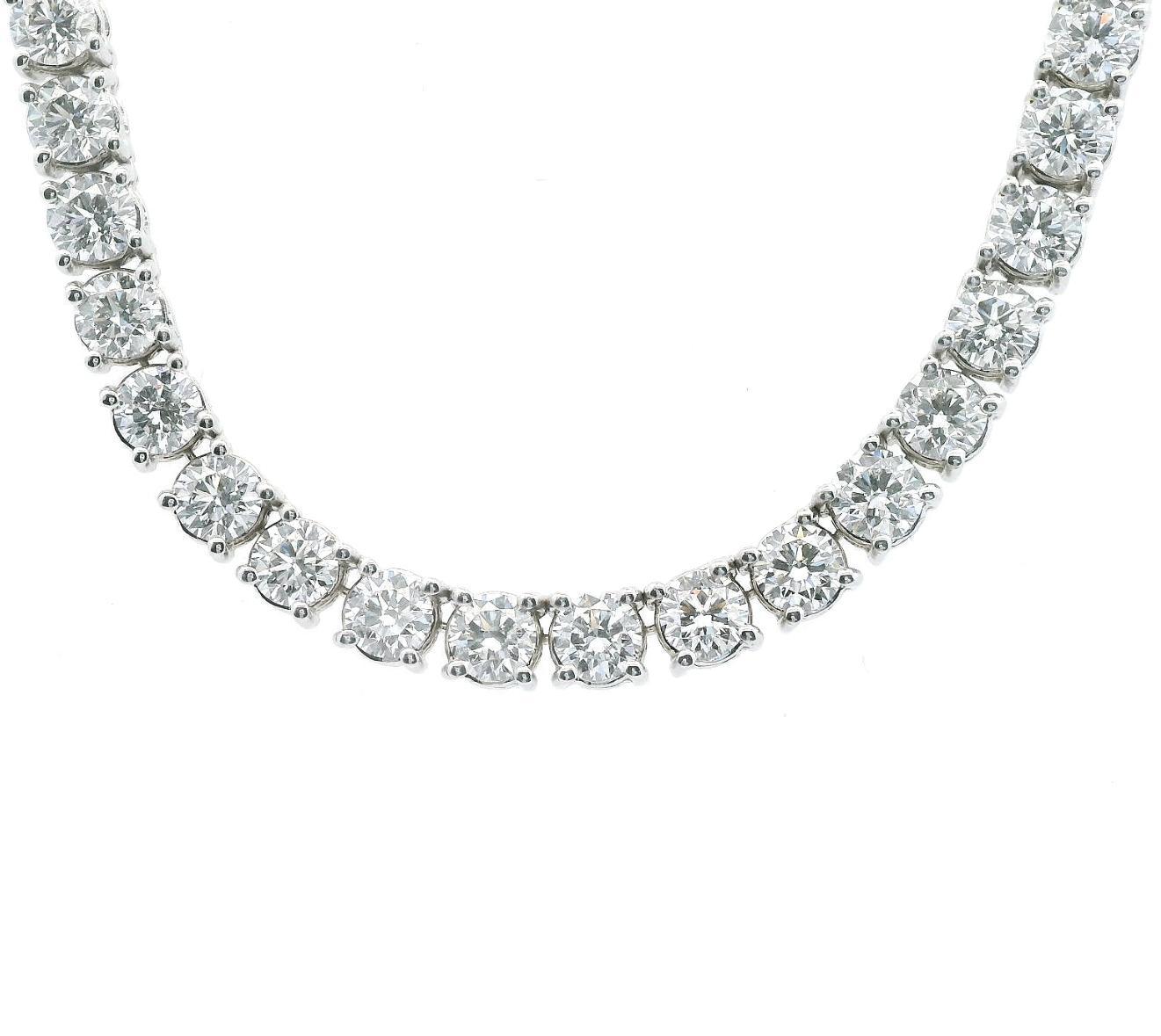 Sensational classic natural diamond tennis necklace, each stone GIA certified. High jewelry by Alexander Beverly Hills.
86 round brilliant diamonds, 32.73 carats (0.38ct avg). Each stone GIA certified, D-F color grade and VVS1-VS2 clarity. 18-karat