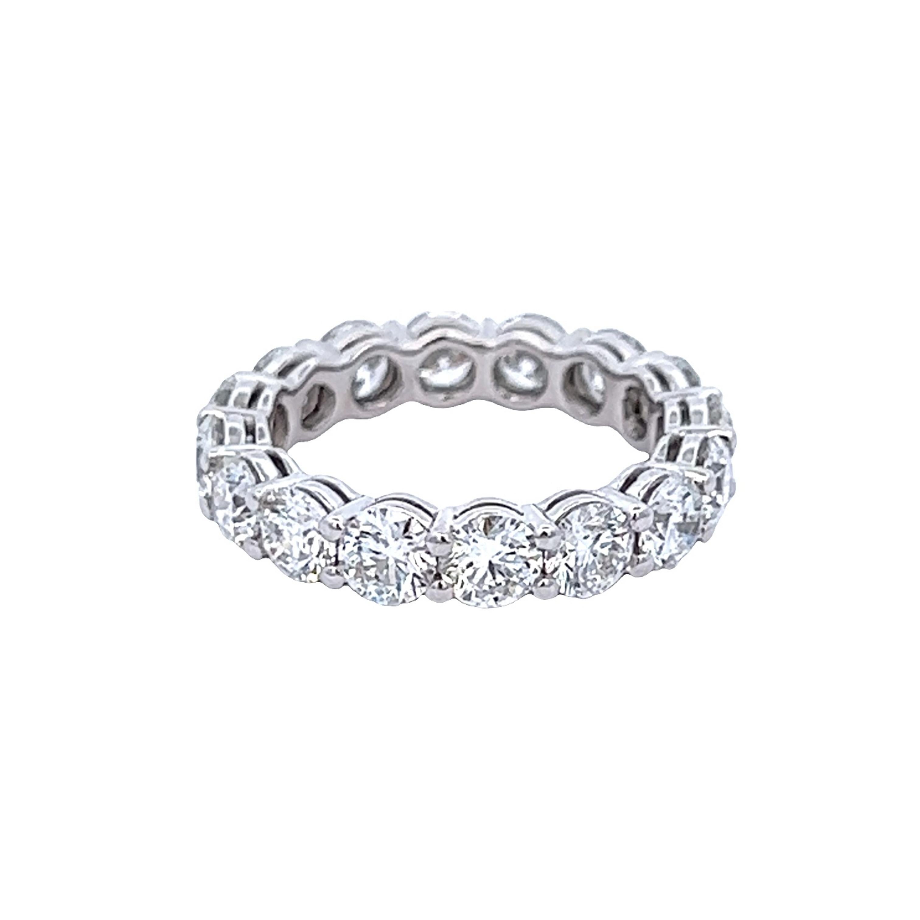 Timeless diamond eternity band, each stone GIA certified. By Alexander Beverly Hills.
16 round brilliant diamonds, 4.80 carats. All stones GIA certified E color and SI1 clarity. Prong set in platinum, 6.86 grams, size 7.
Accommodated with an