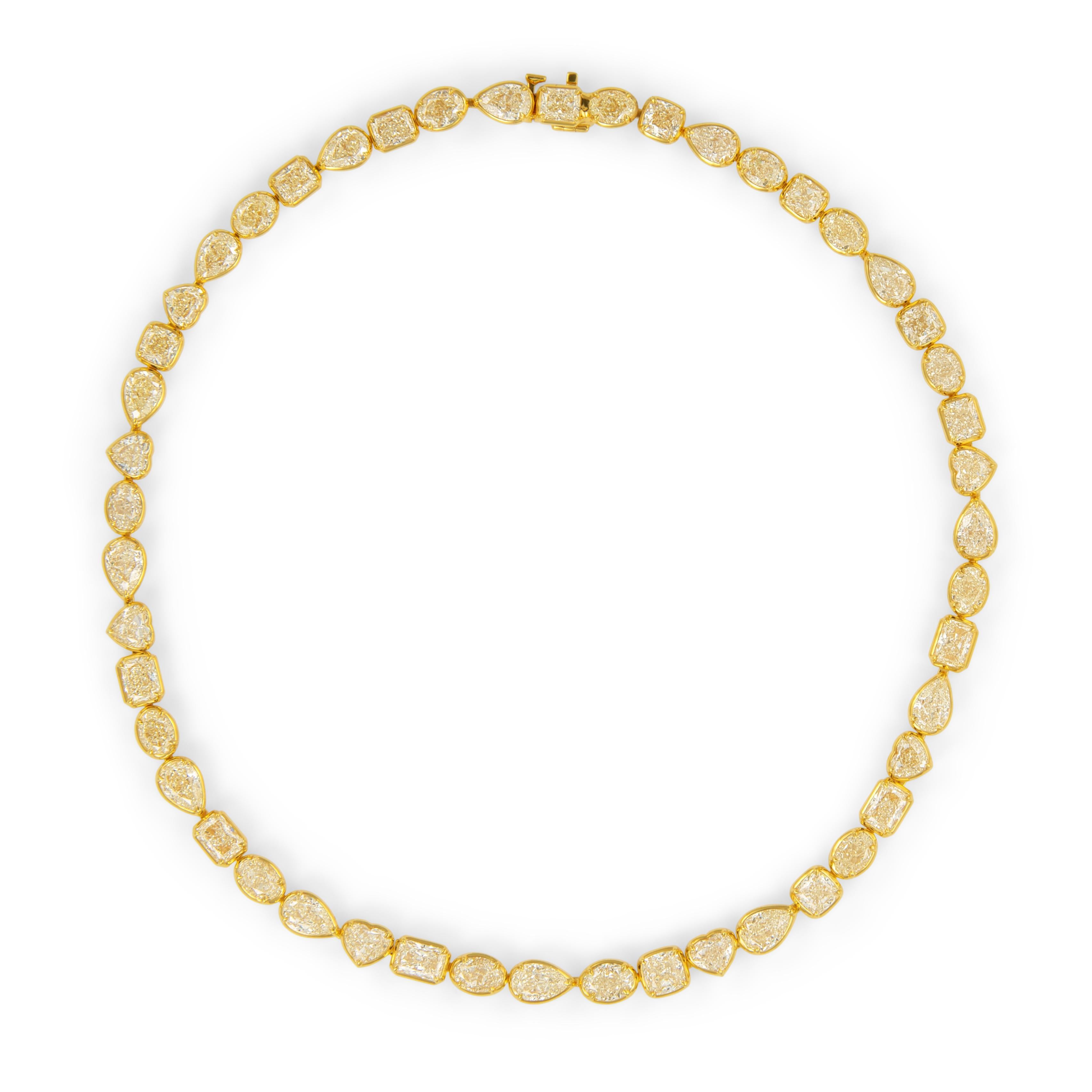 Sensational modern alternating multi natural yellow diamond bezel set tennis necklace, EGL certified. High jewelry by Alexander Beverly Hills.
48 oval, heart, radiant, pear, and cushion shape yellow diamonds, 49.96 carats (avg 1.04ct). Fancy-Fancy