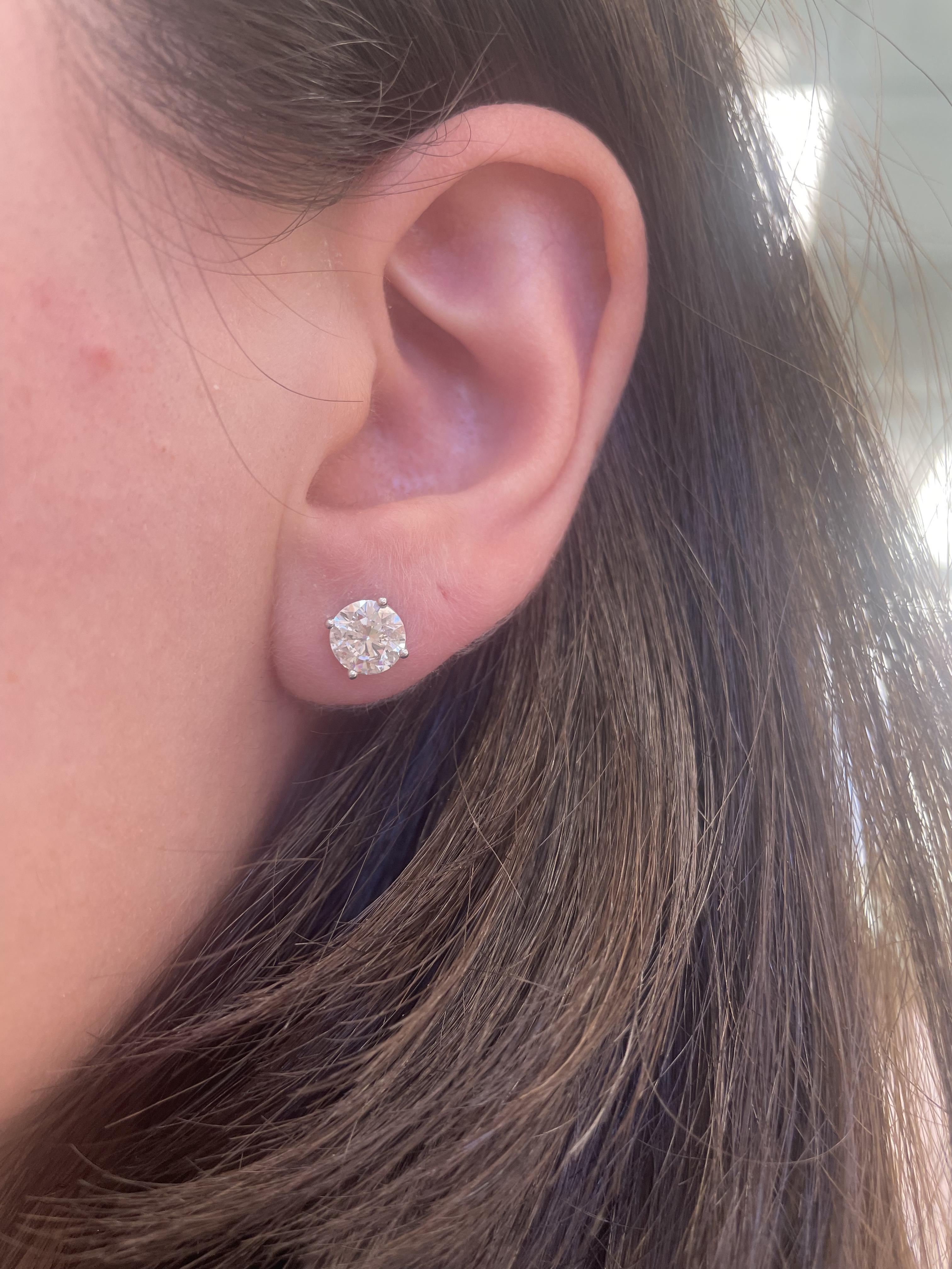 Classic diamond stud earrings, each stone EGL certified, by Alexander Beverly Hills.
Two matching round brilliant diamonds 2.02 carats total. Both stones EGL certified F color grade and SI3 clarity grade. 14-karat white gold, 1.63