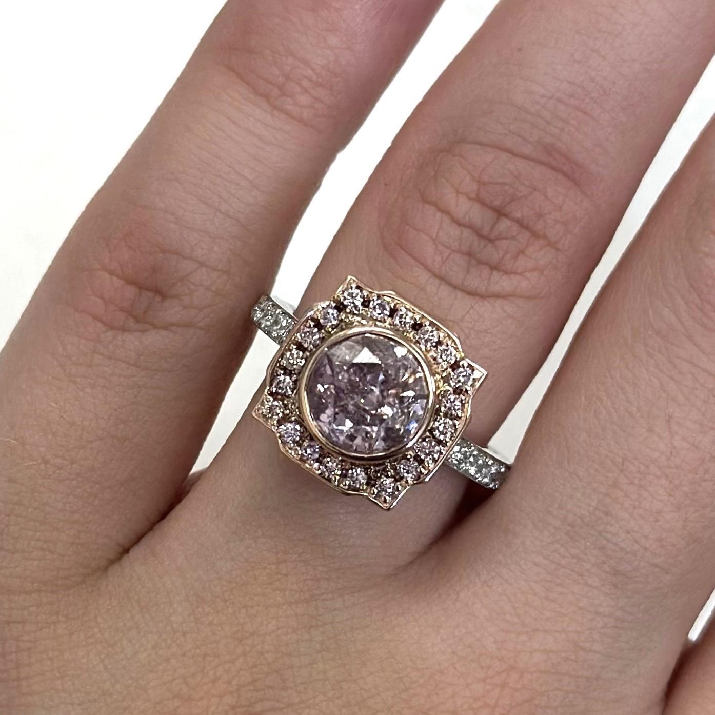 Stunning light pink diamond (looks fancy pink in the ring) with fancy pink diamond halo and fancy pink diamond basket, GIA certified. High jewelry by Alexander Beverly Hills.
2.54 carats total diamond weight.
1.86 carat round brilliant diamond,