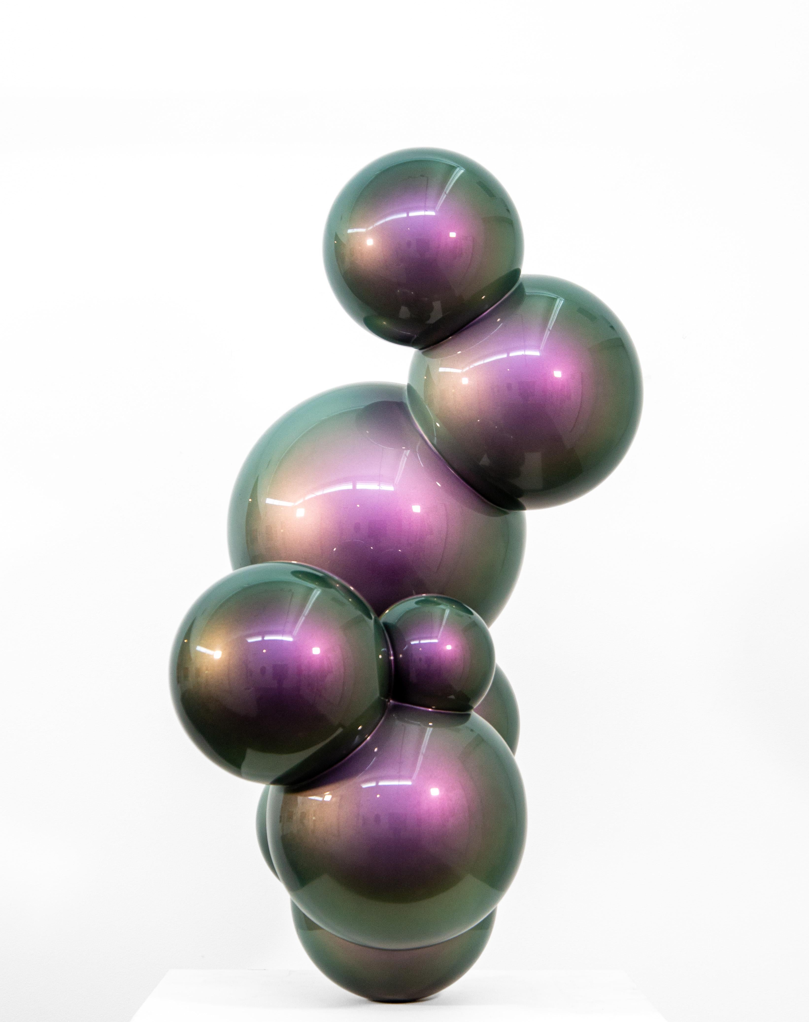 From his foundry in a Calgary warehouse, Alexander Caldwell creates compelling and cool modern sculptures. This minimalist piece—a series of linked stainless-steel spheres of different sizes— appears almost molecular in form. Coated in a shiny
