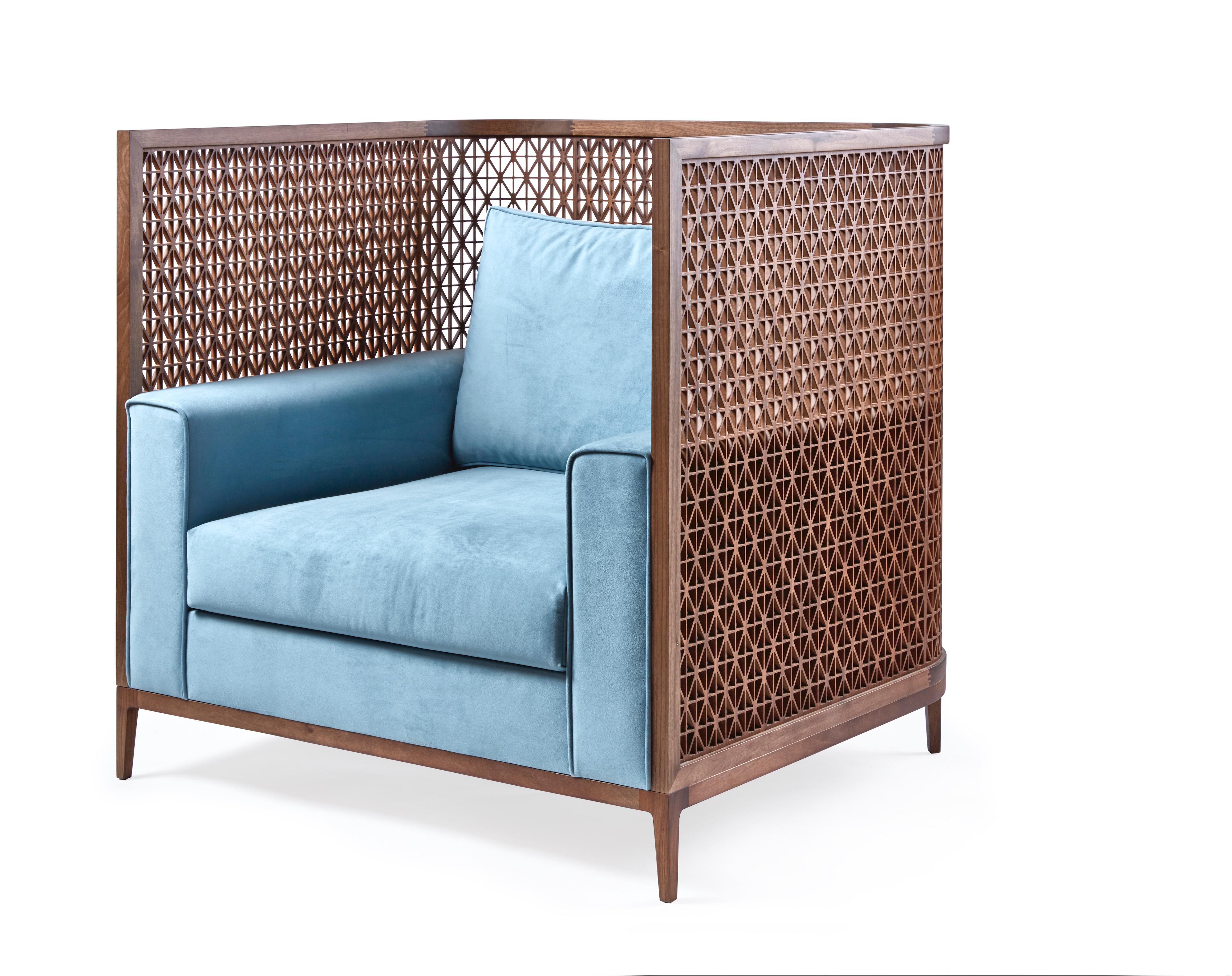 The intricately carved trellis details wrapped around the back of this generously proportioned occasional chair make it ideal to float in a room where it can be admired from every angle.