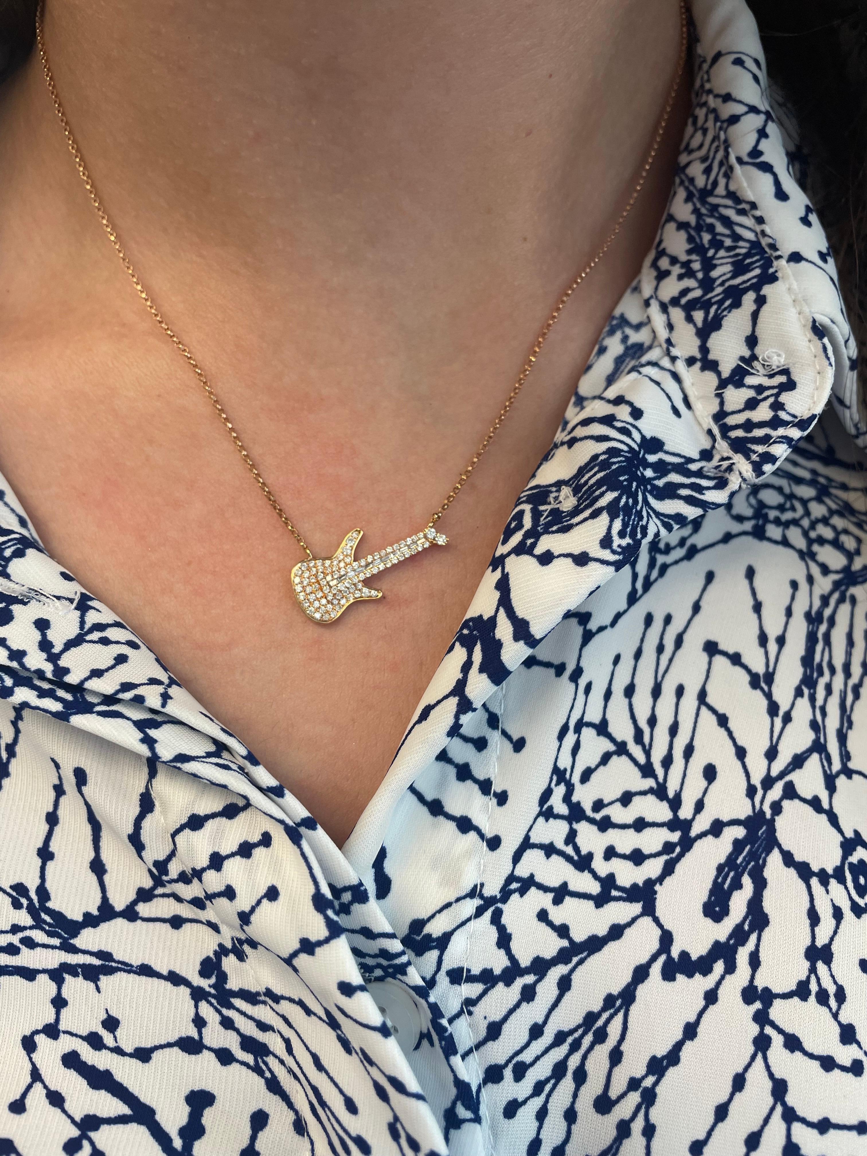 Exquisite and timeless guitar diamond pendant necklace. By Alexander Beverly Hills.
93 round and baguette diamonds, 0.39ct carats total. Approximately GH color and SI clarity. Four prong and invisible set in 18k rose gold.
Accommodated with an