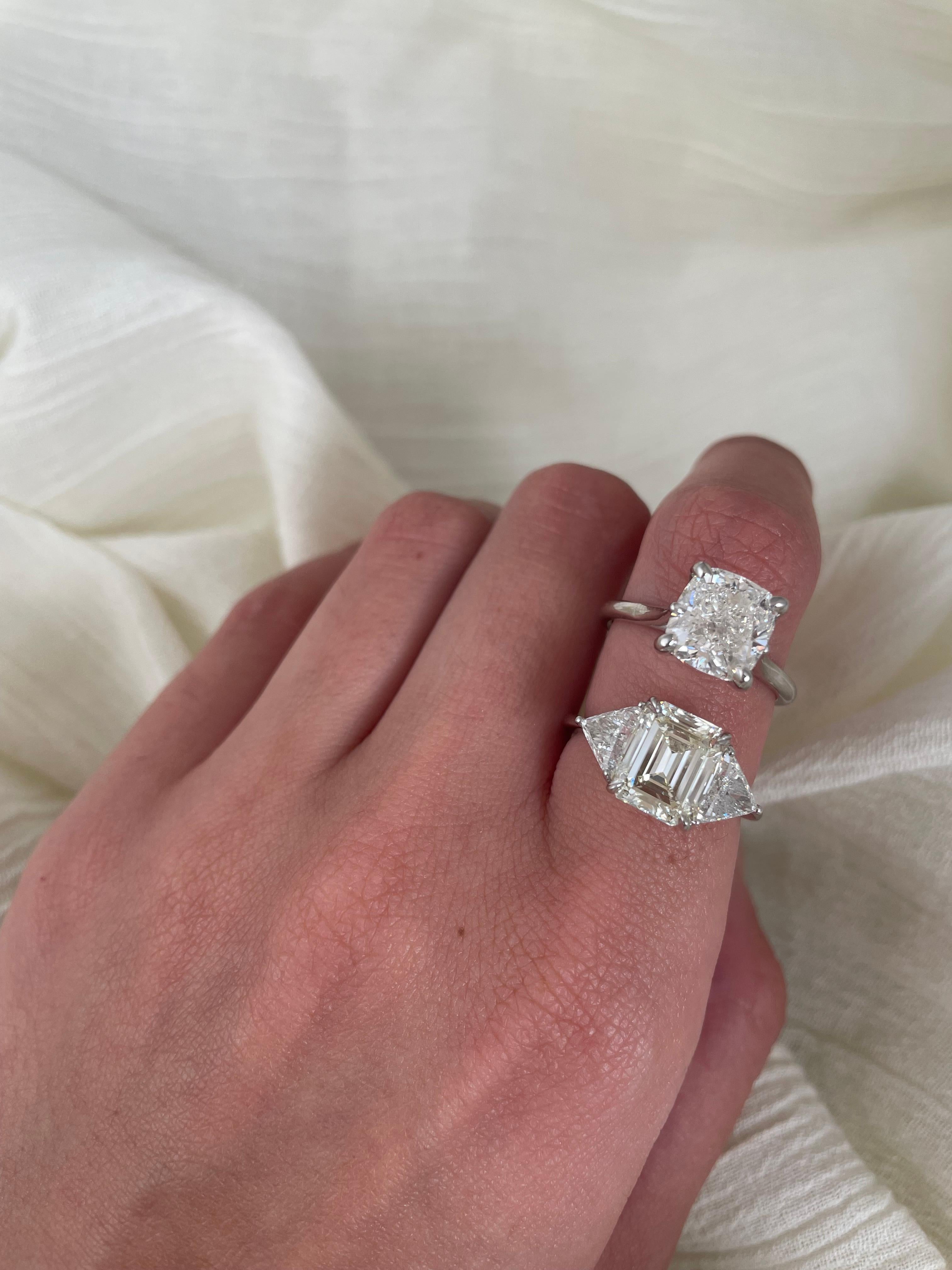 Stunning and classic three-stone diamond engagement ring, EGL certified. 
High jewelry by Alexander Beverly Hills. 
Center stone, 2.85ct emerald cut diamond. L color grade, VS1 clarity grade, EGL certified. Side stones, 2 trilliant cut diamonds,