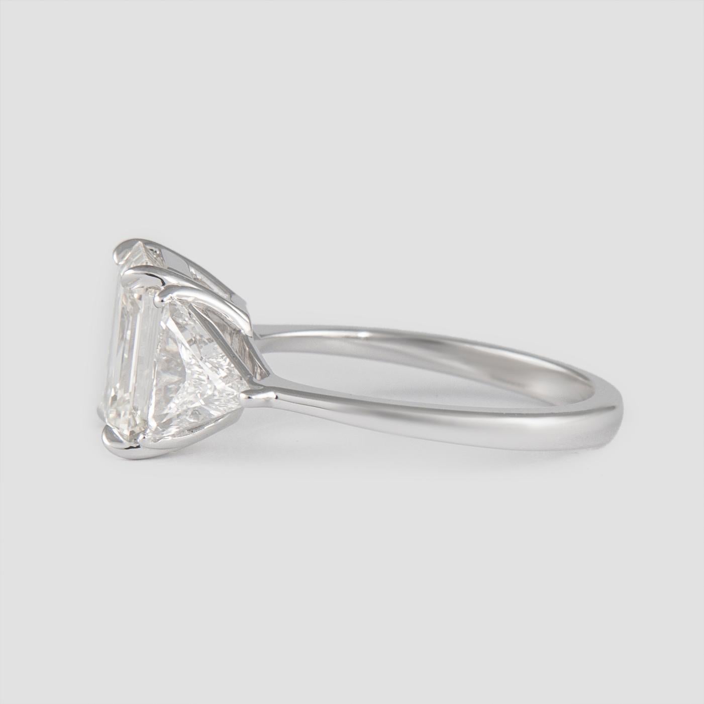 Modern Alexander EGL Certified 2.85 Carat Emerald Cut Diamond Three-Stone Ring 18k