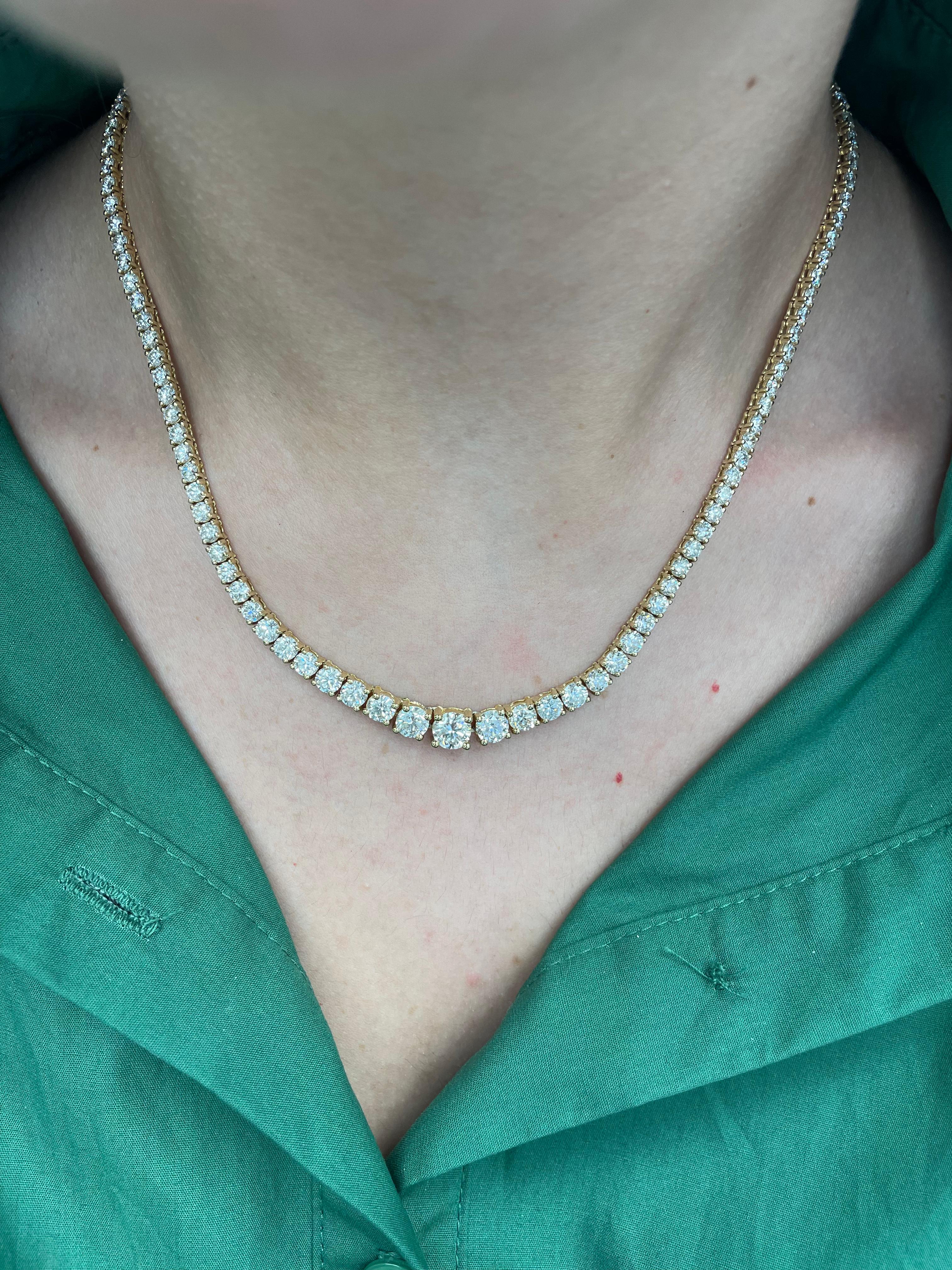 Beautiful and classic diamond tennis necklace, by Alexander Beverly Hills.
12.70 carat total diamond weight.
Center 1.00 carat round brilliant diamond, H color grade and SI1 clarity grade, GIA certified. 95 round brilliant diamonds, 11.70 carats.