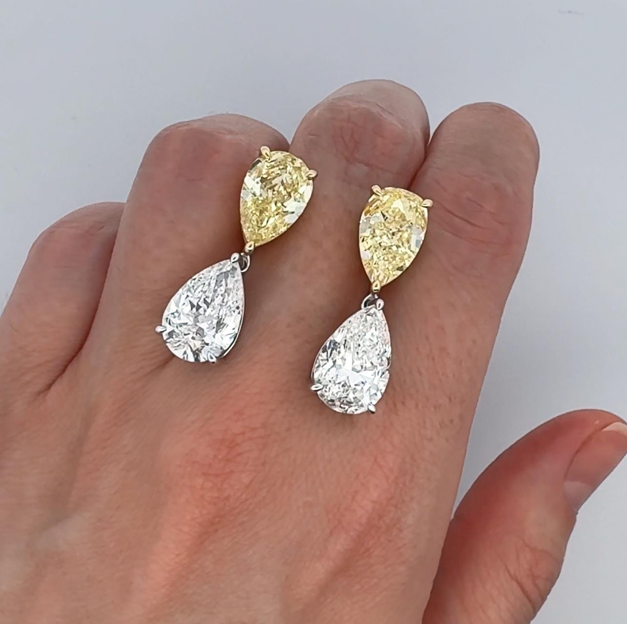 Sensational and important fancy intense yellow and white diamond drop earrings. Incredibly rare to match such stones, a piece like this is typically seen only in the major high jewelry house and major auction houses. Each stone GIA certified. High