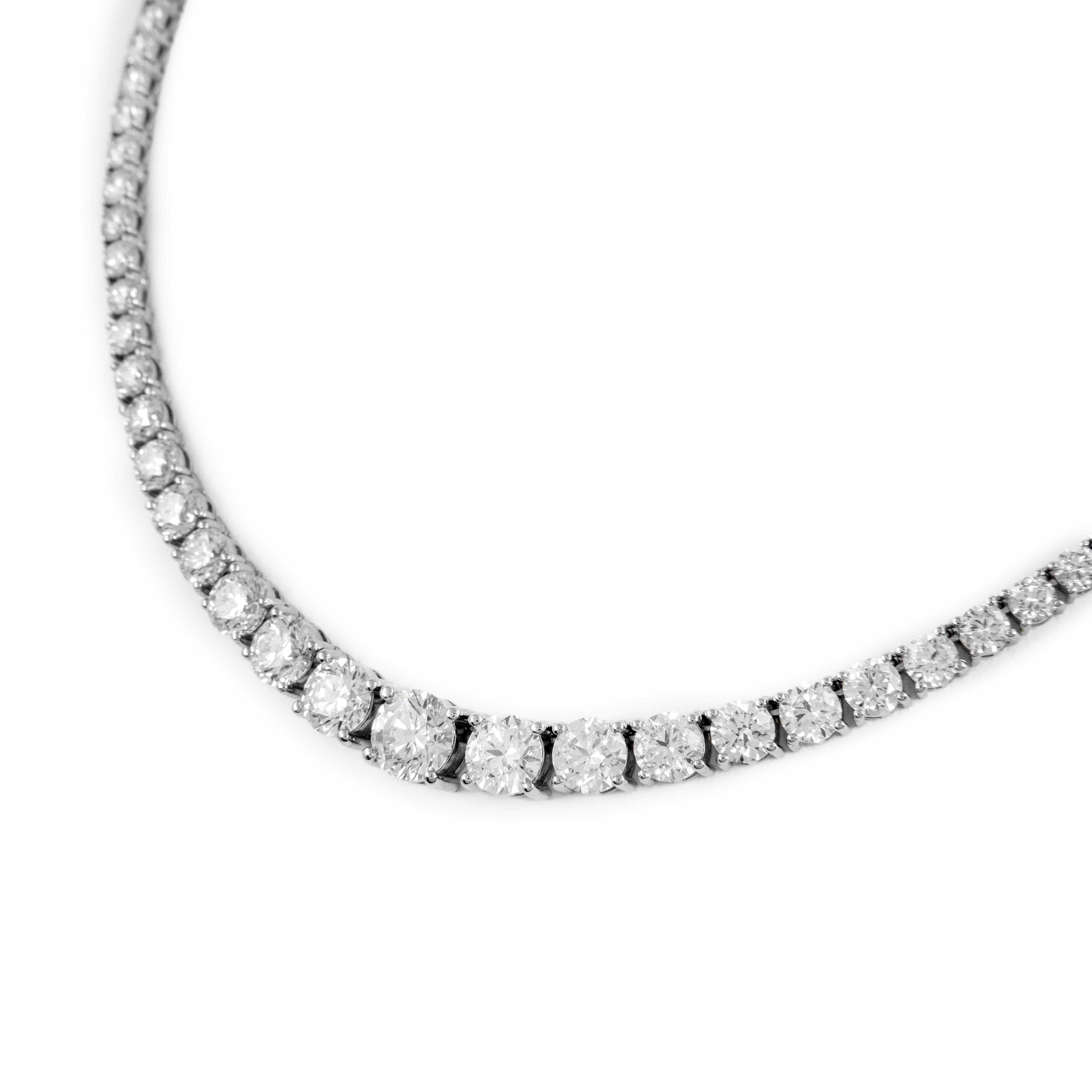 Beautiful and classic diamond tennis riviera necklace, GIA certified, by Alexander Beverly Hills.
99 round brilliant diamonds, 22.38 carats, 5 stones GIA certified. Approximately H-J color and VS1-SI2 clarity. 18k white gold, 30.56 grams,