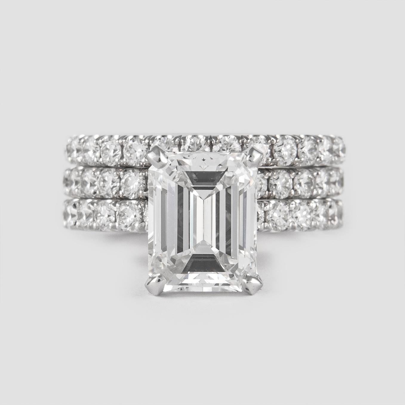 Stunning and classic diamond engagement ring with two eternity bands, GIA certified. 
High jewelry by Alexander Beverly Hills.
Center stone, 3.16ct emerald cut diamond. F color grade & VS1 clarity grade, GIA certified. Side stones, 40 round