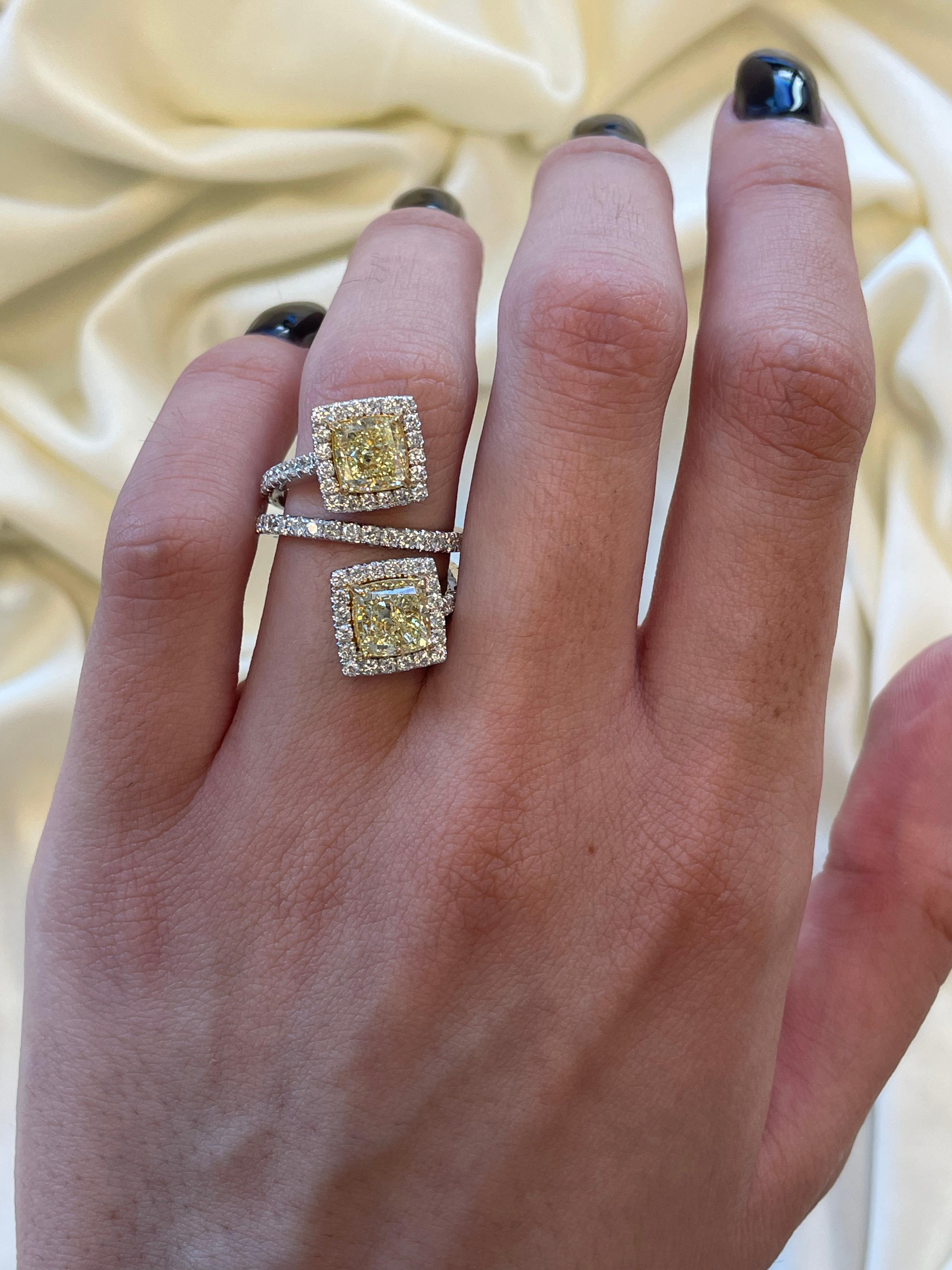 Stunning modern floating diamond bypass toi et moi ring, both stones GIA certified. High jewelry Alexander Beverly Hills.
4.69 carats total diamond weight.
2 cushion diamonds, 4.69 carats. One stone WX color and VVS1 clarity, the other YZ color and