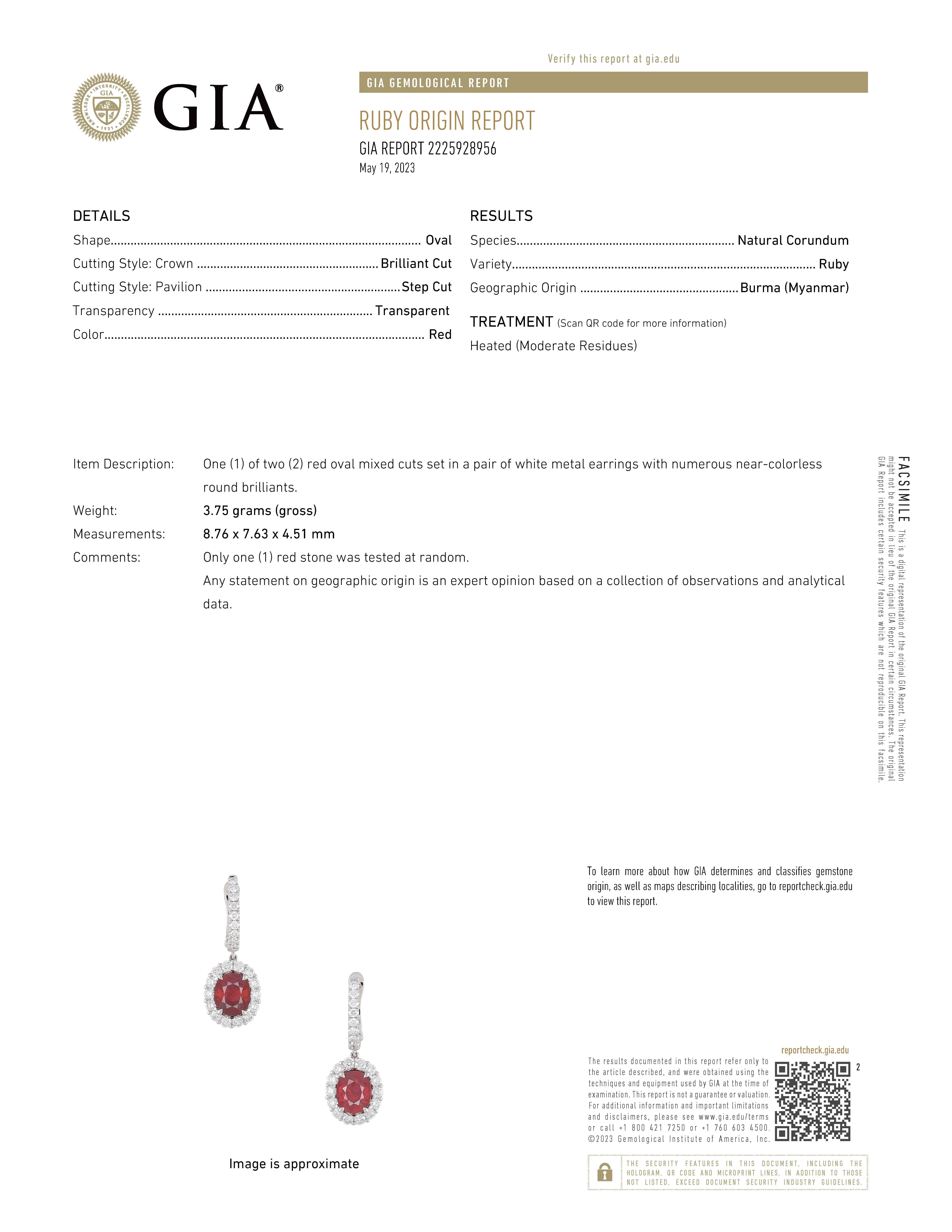 Sensational ruby and diamond drop earrings. Very clean rubies with superb vivid red color. Created by Alexander Beverly Hills.
6.81 carats total metal weight. 
2 GIA certified oval Burma rubies, 4.91 carats total. Complimented by 46 round brilliant
