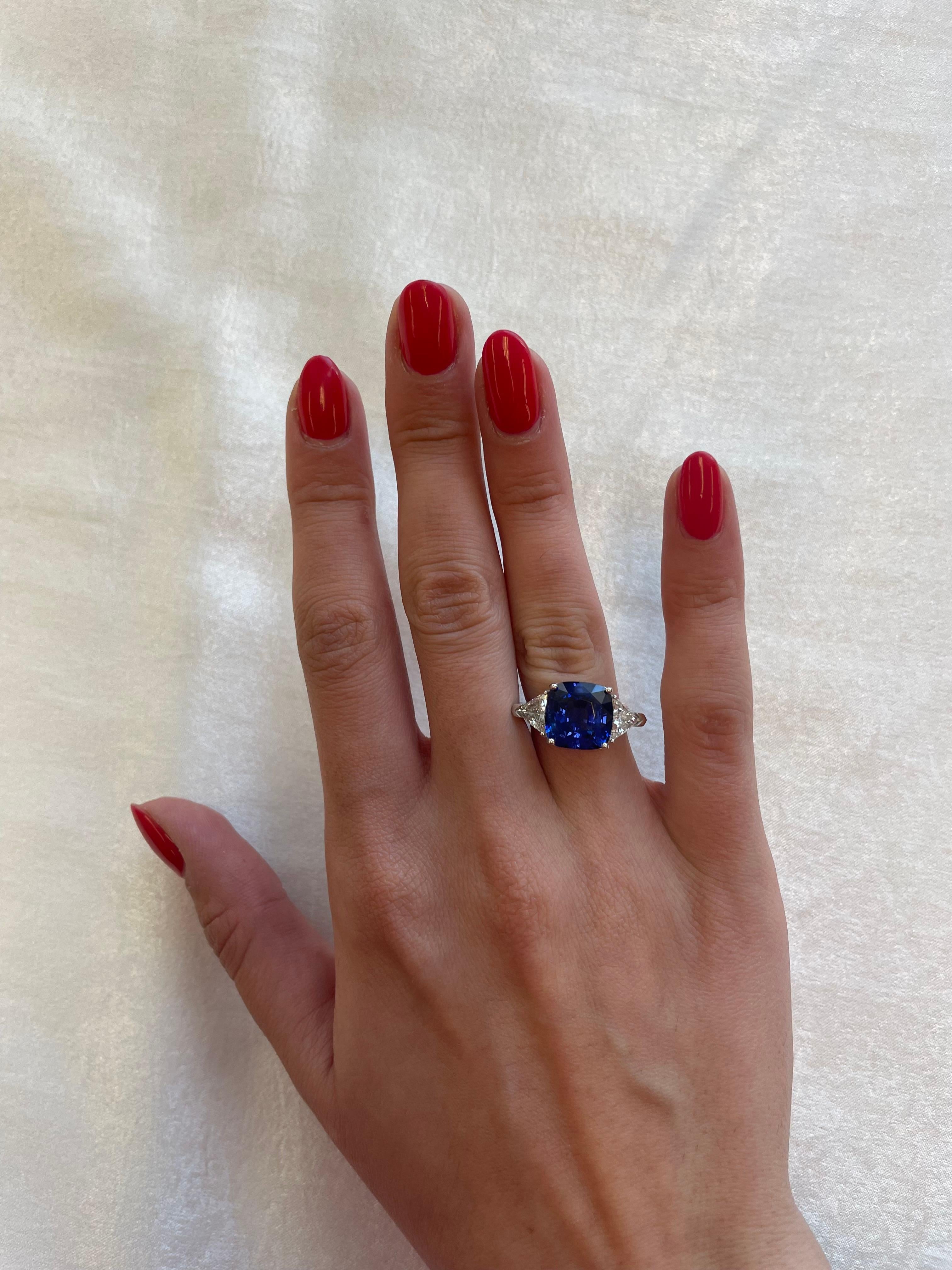 Exquisite sapphire and diamond three stone ring. High jewelry by Alexander Beverly Hills.
7.11 carat cushion sapphire, GIA certified heat. Complimented with a pair of trilliant diamonds, 1.29ct. Approximately G/H color and SI clarity. 8.40ct total