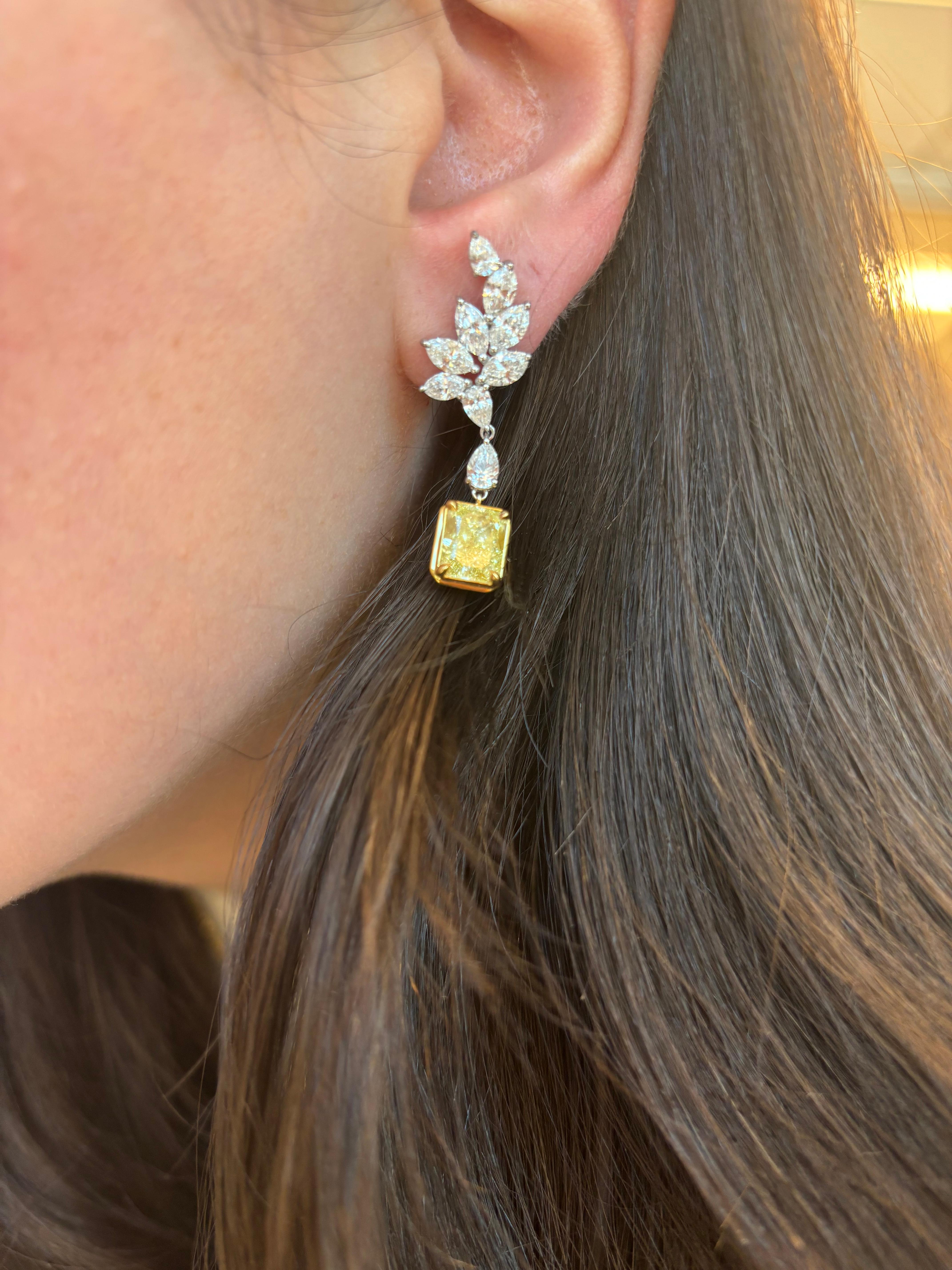 Stunning fancy yellow diamonds (that look fancy intense) with halo earrings, GIA certified. High jewelry by Alexander Beverly Hills. 
8.40 carats total diamond weight. 
*Center stones look Fancy Intense Yellow in the mounting 
2 radiant cut