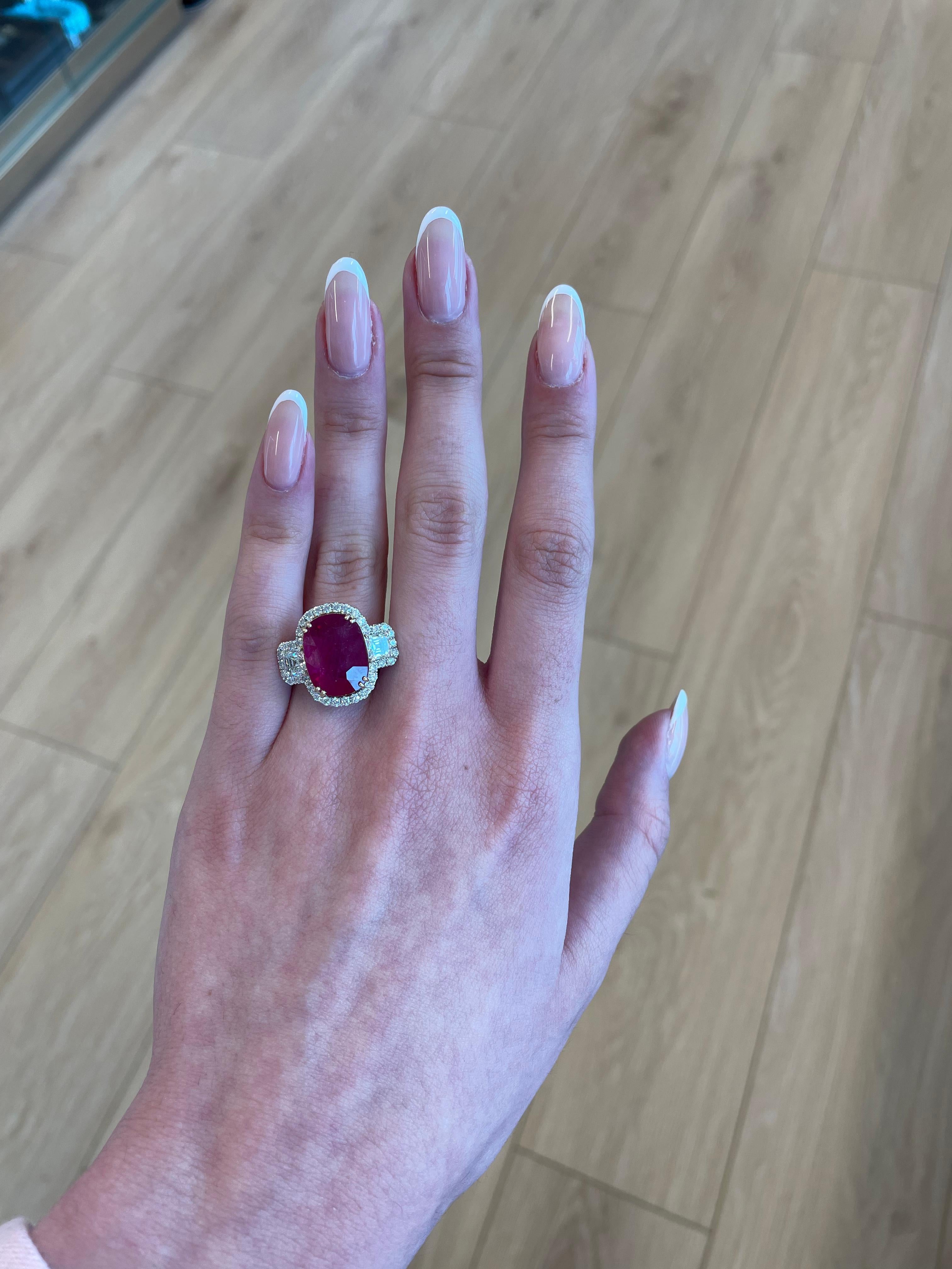 Stunning diamond and diamond three stone ring with halo. High jewelry by Alexander Beverly Hills. 
12.33 carats total gemstone weight.
10.24 carat oval ruby, GIA certified heat. 2 asscher cut diamonds, 1.12 carats. Approximately G/H color and VS
