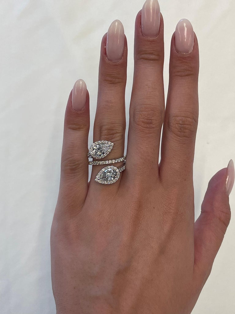 Stunning modern floating diamond bypass toi et moi ring, both stones GIA certified. High jewelry Alexander Beverly Hills.
3.24 carats total diamond weight.
2 pear shape diamonds, 2.10 carats. One stone E color and VVS1 clarity, the other D color and