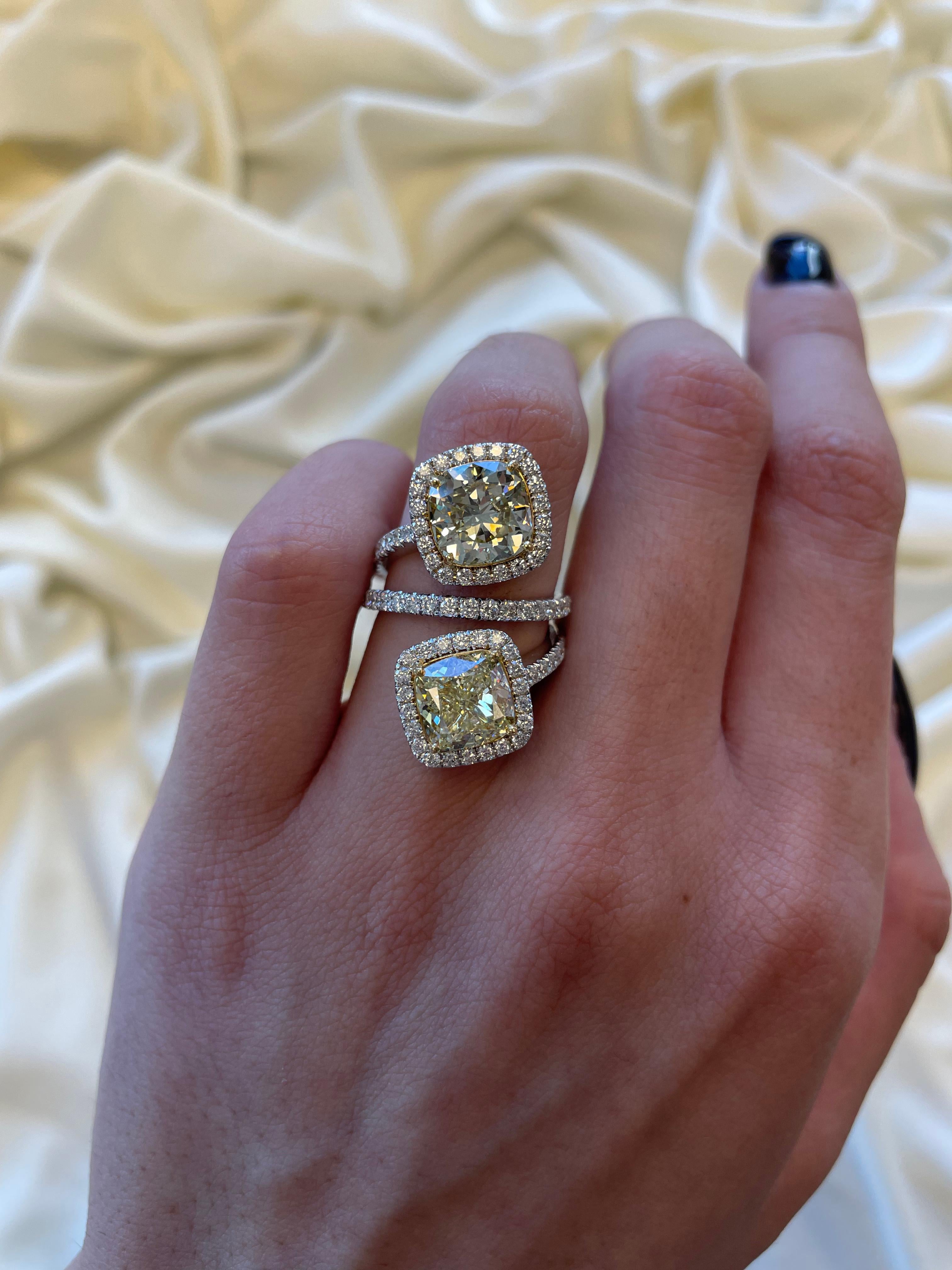Stunning modern floating diamond bypass toi et moi ring, both stones GIA certified. High jewelry Alexander Beverly Hills.
7.52 carats total diamond weight.
2 cushion diamonds, 6.12 carats. One stone Fancy Yellow color and VS2 clarity, the other