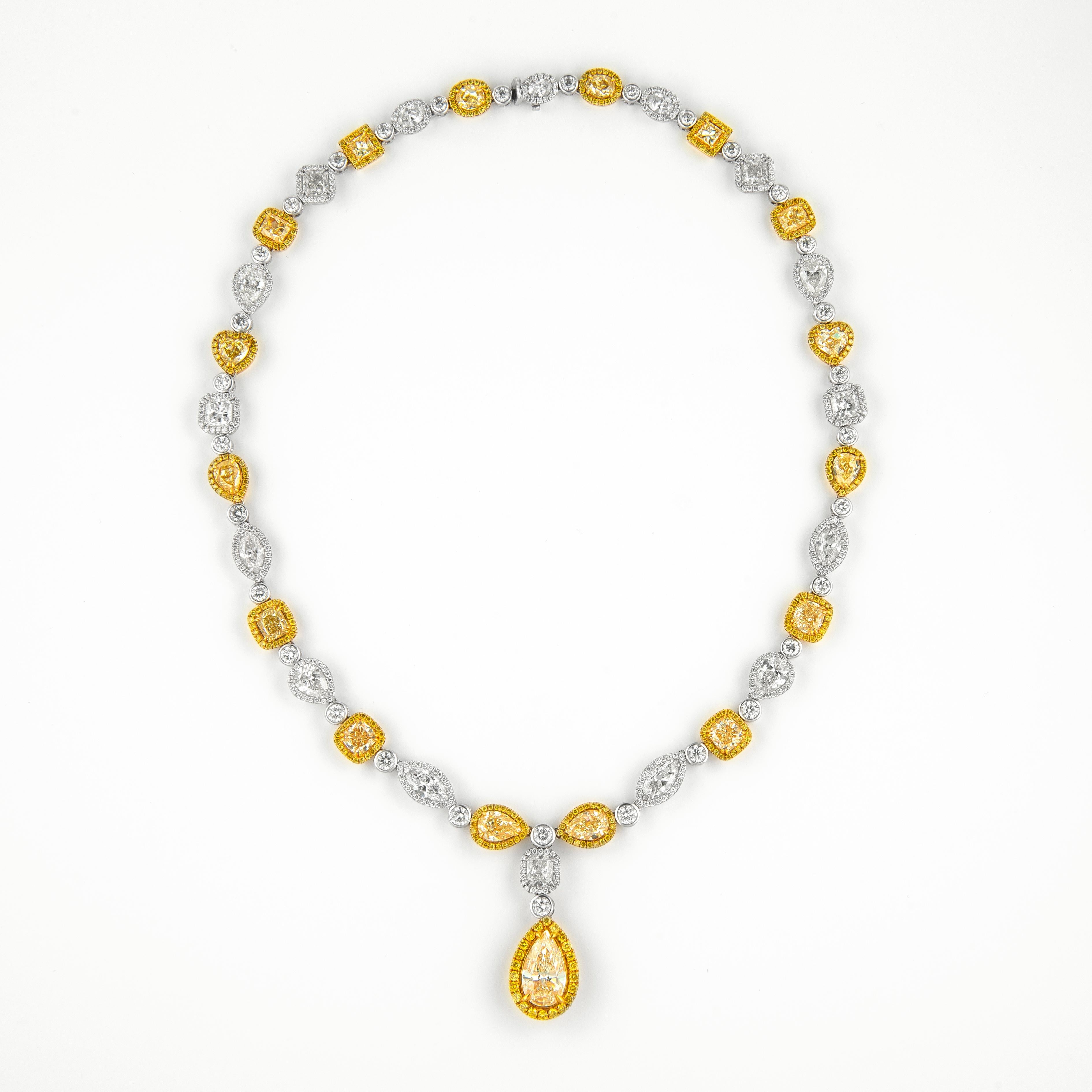 Impressive alternating yellow and white diamond drop necklace, most center stones GIA or EGL certified (20 total). High jewelry by Alexander Beverly Hills. 
49.89 carats total gemstone weight.
Center 5.01 carat pear shape diamond, Fancy Light Yellow