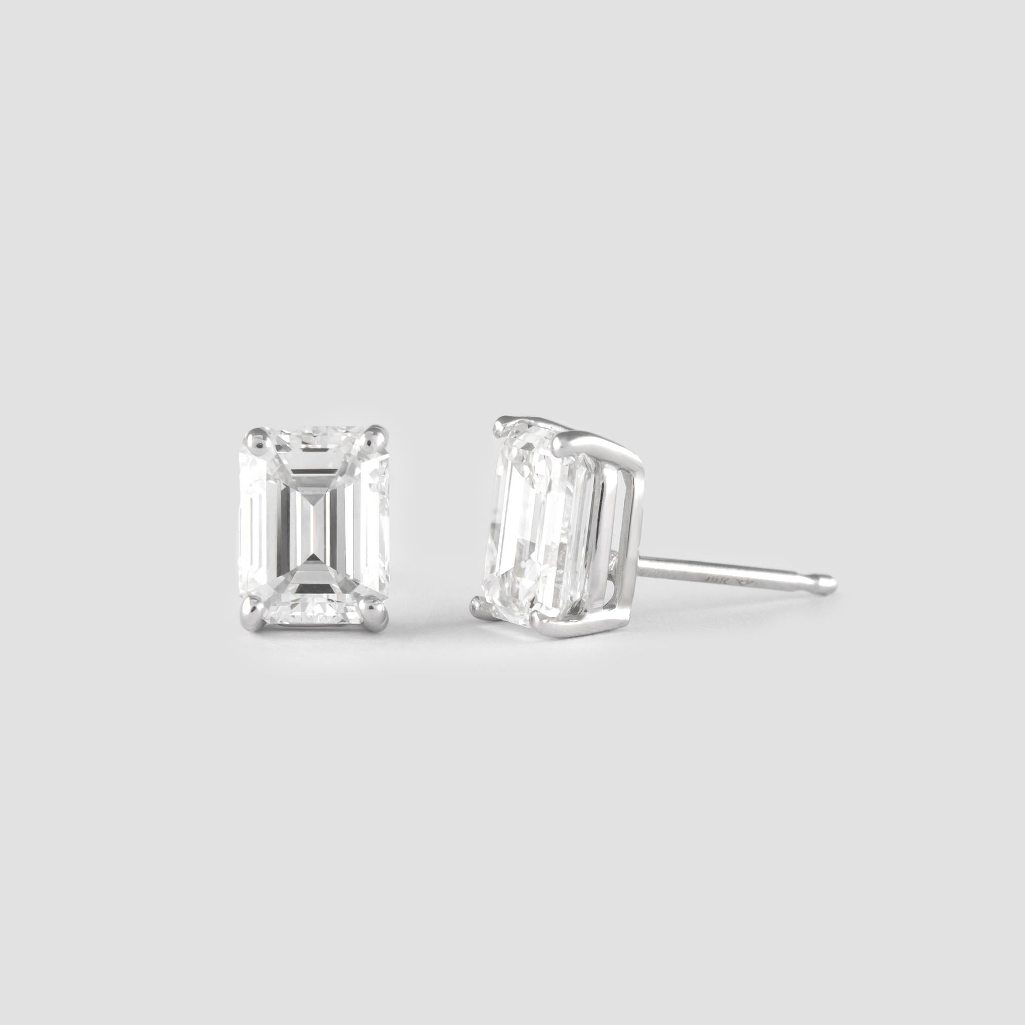 Classic diamond stud earrings, each stone GIA certified. 
Two matching emerald cut diamonds 2.37 carats total. Both G color and VS1 clarity. Four prong set, 14k white gold.
Accommodated with an up to date appraisal by a GIA G.G., please contact us