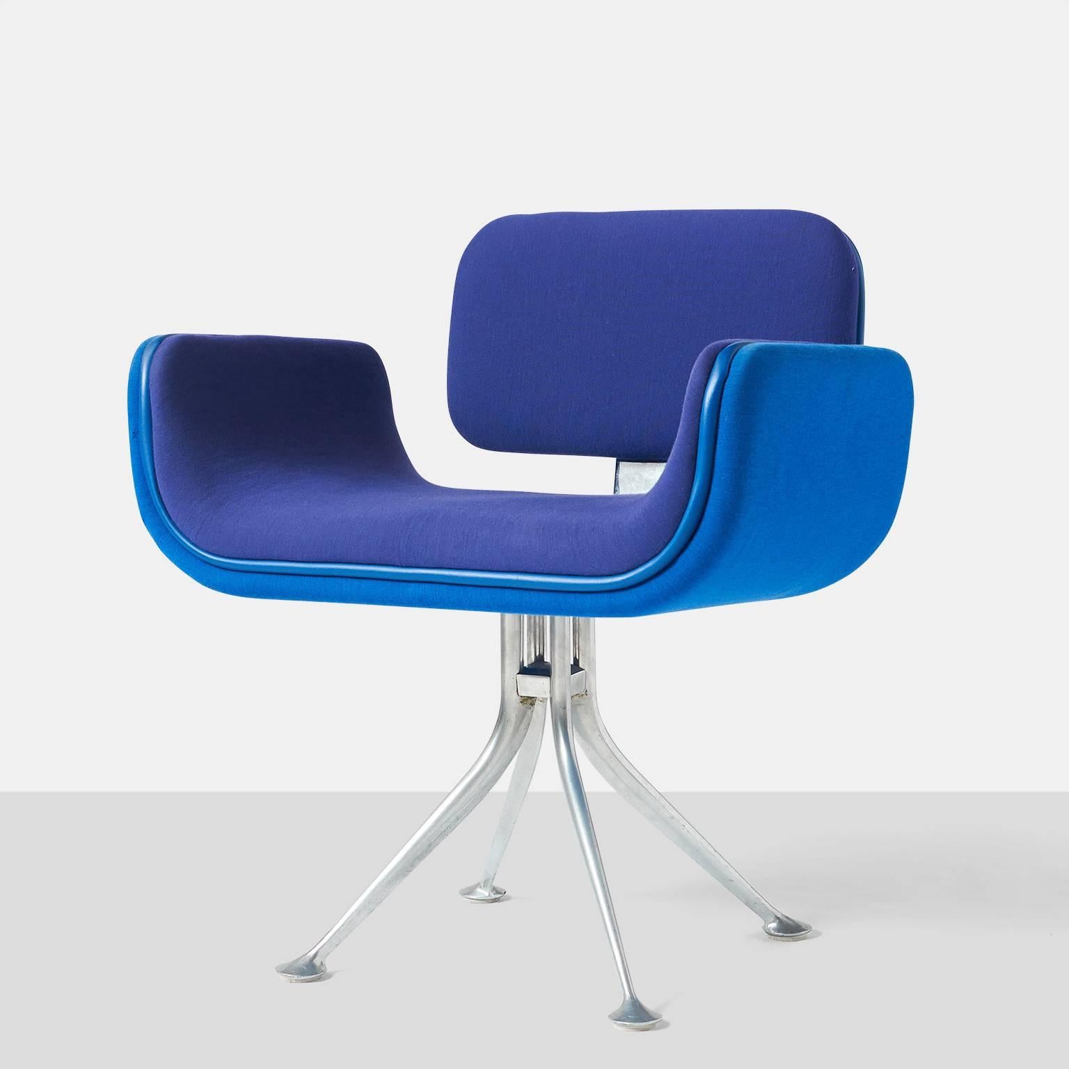 Alexander Girard armchair
An armchair by Alexander Girard for Herman Miller. A cast aluminum frame supports an upholstered seat that is shaped in steel and buffered with rubber edging. Upholstery in contrasting blues. Part of the collection that