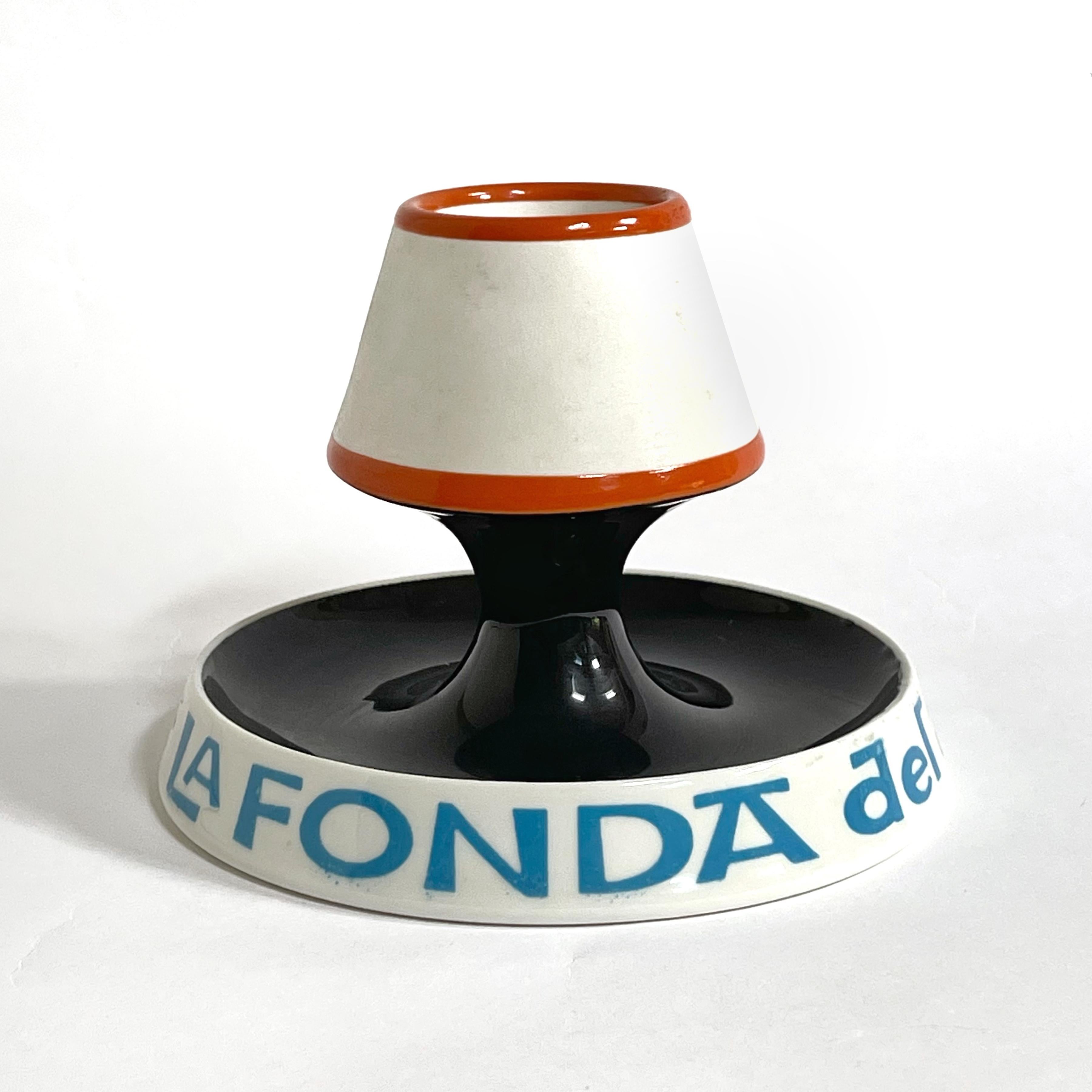 This sweet, sculptural piece designed by Alexander Girard and made by Mayer China Minners & Co for the NY restautant La Fonda del Sol. The glazed porcelain form is both a match holder/ striker, and an ashtray. This is a great example of Girard's