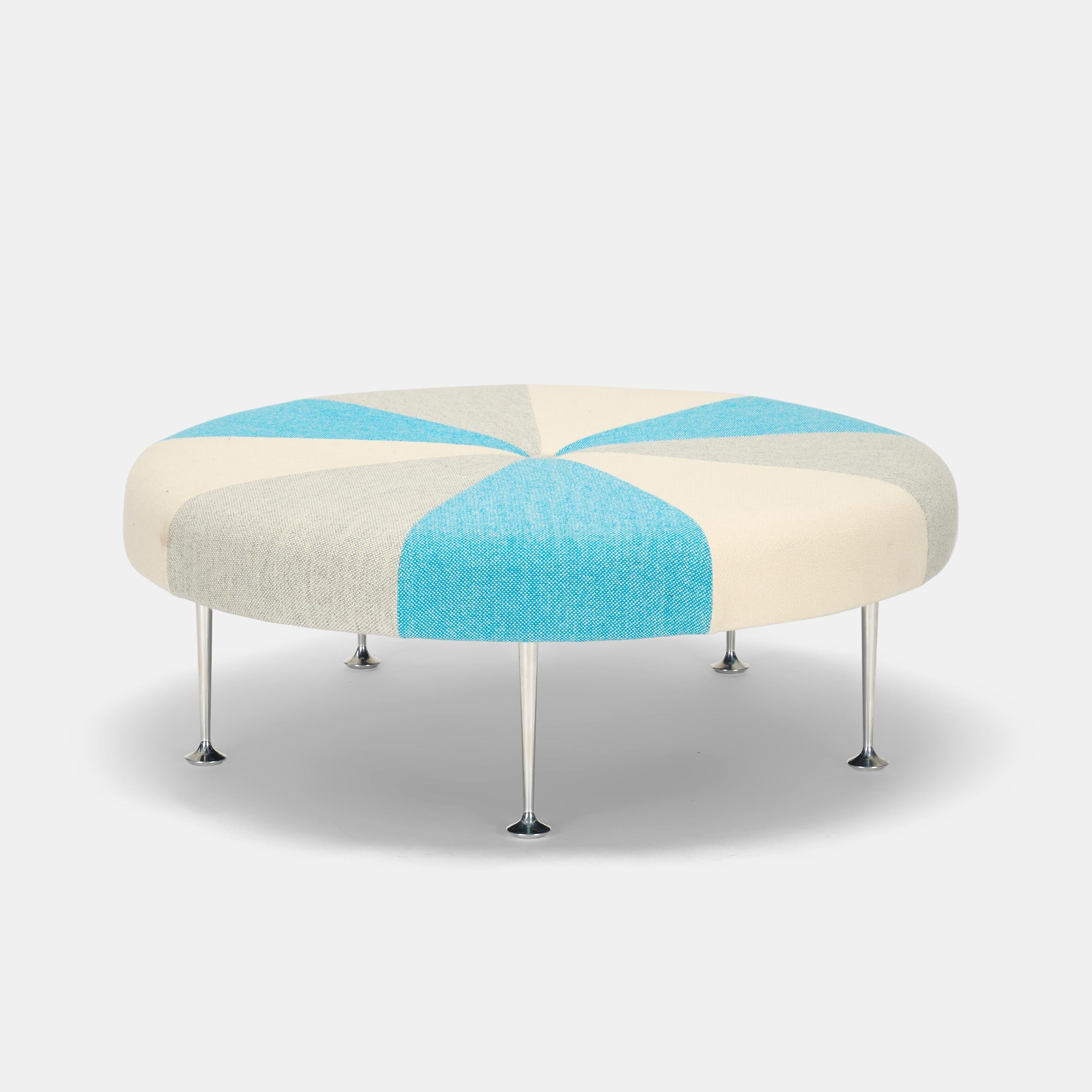Alexander Girard created over 300 textiles as the director of design for the Herman Miller Textile division between from 1952 into the 1970s. He designed his Color Wheel Ottoman in 1967 with pinwheel colors that coordinate with an array of