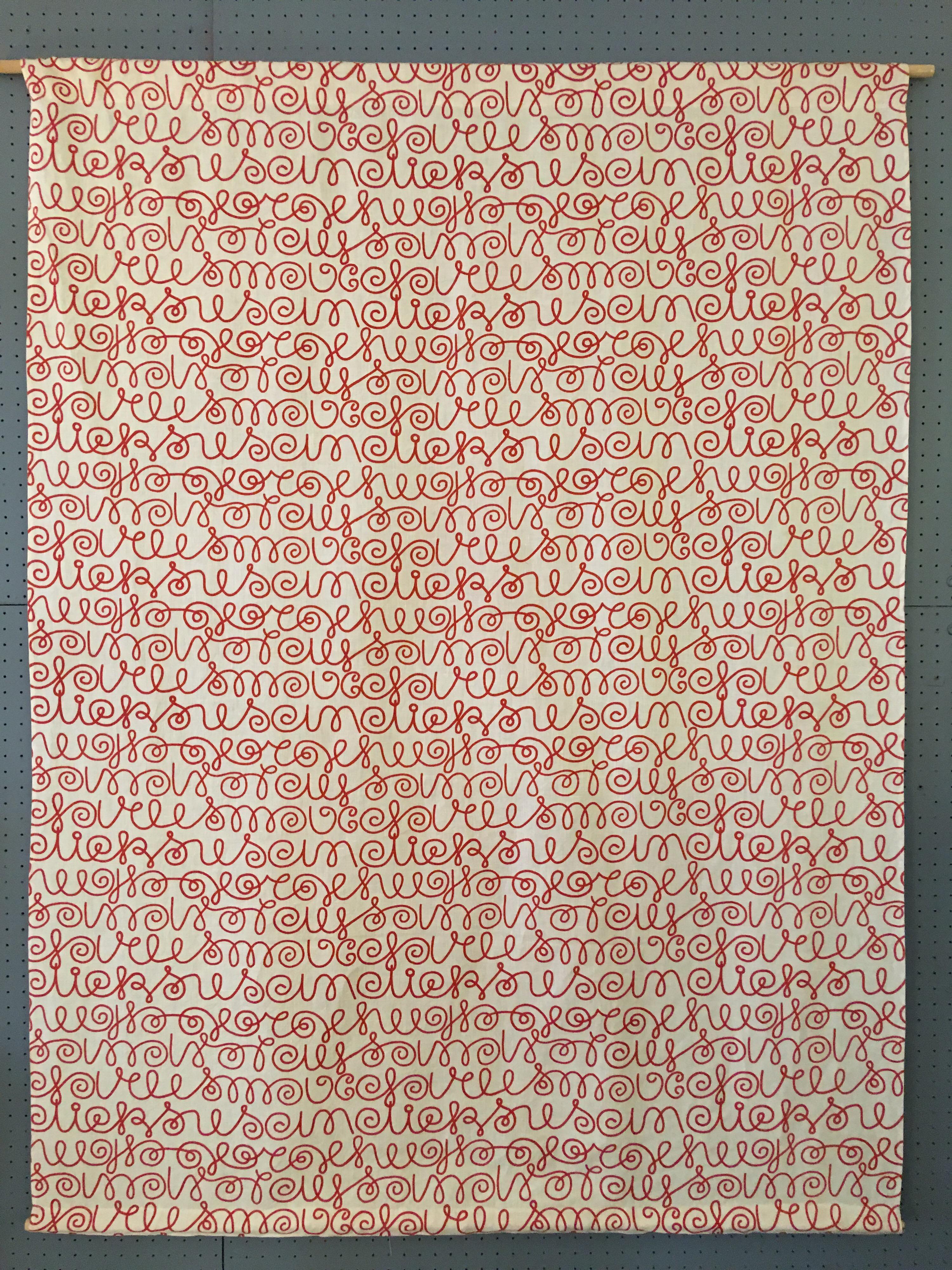 Alexander Girard Linen wall hanging in a cursive script pattern. Cream Linen background with red type. Herman Miller re-issued Girard fabrics 15-20 years ago.