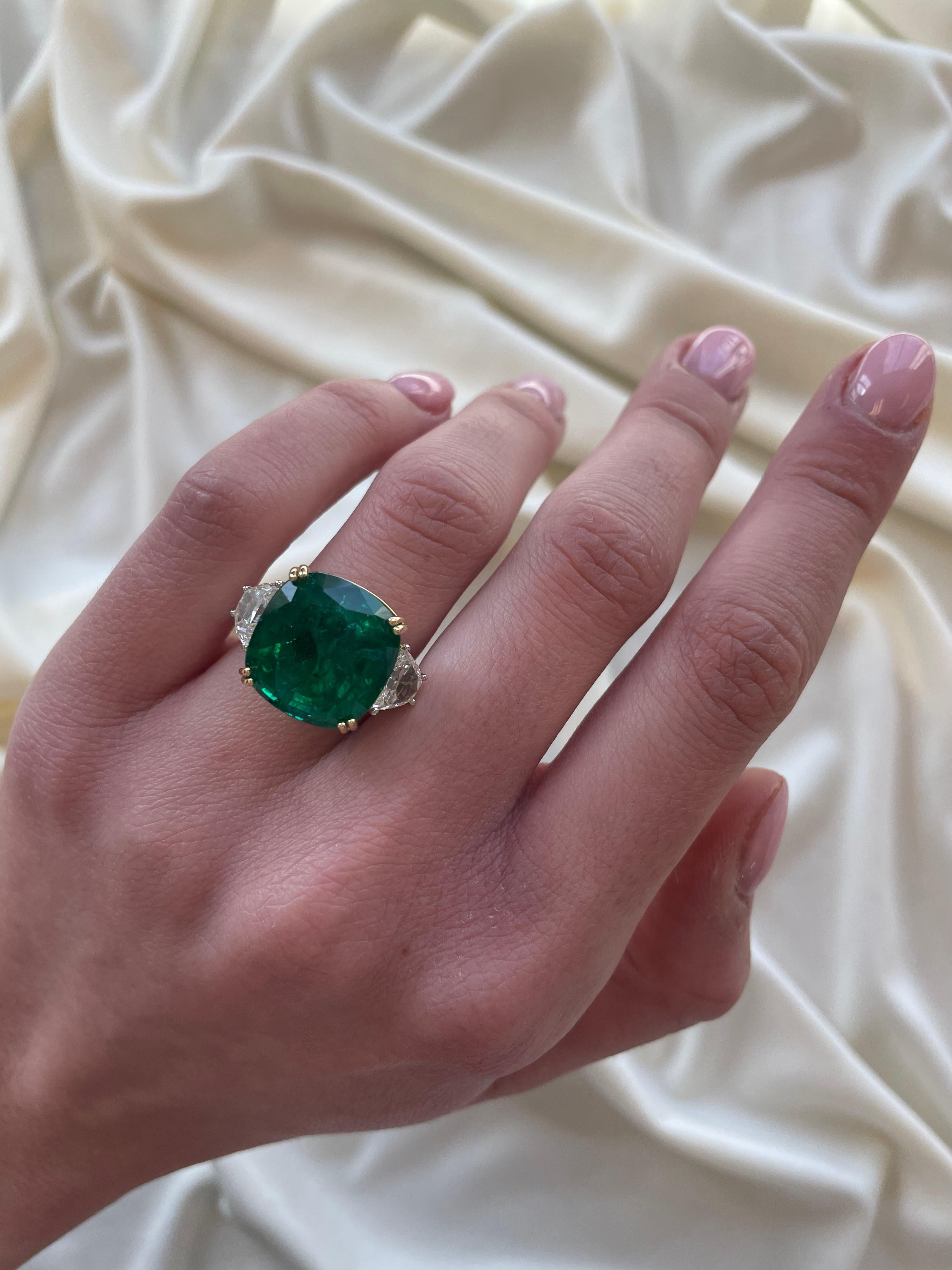 Impressive GRS certified Zambian emerald with GIA certified half-moon diamonds three-stone ring. High jewelry by Alexander Beverly Hills.
15.53 carats total gemstone weight. 
GRS certified 14.09 carat Zambian emerald, Minor. Complemented with 2 GIA