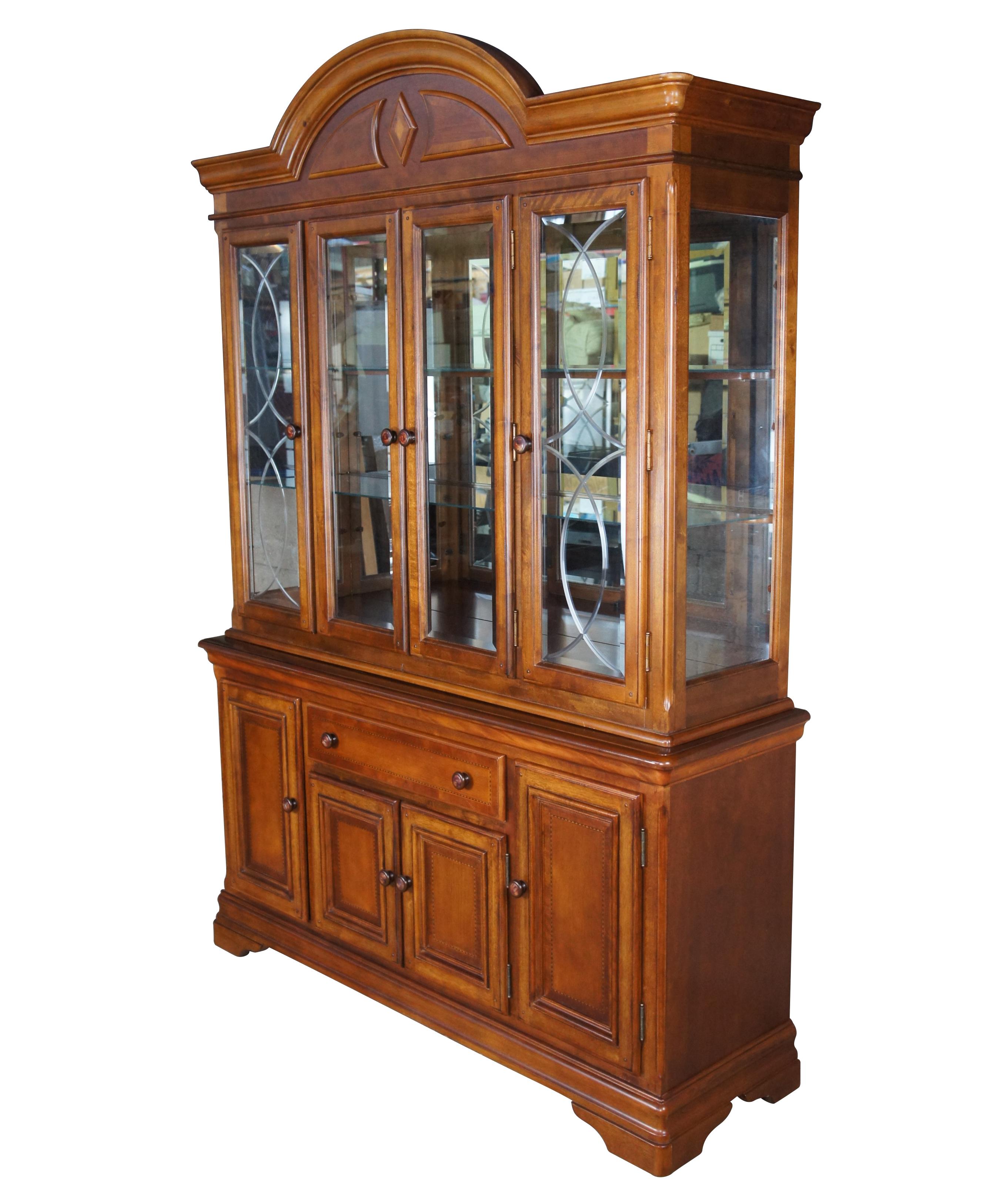 Alexander Julian Home Colours Buffet and Hutch. Made from cherry with geometric inlaid paneling and swirl marble door pulls. Display portion is illuminated with two glass shelves and ornate beveled glass doors. The base has a central drawer with