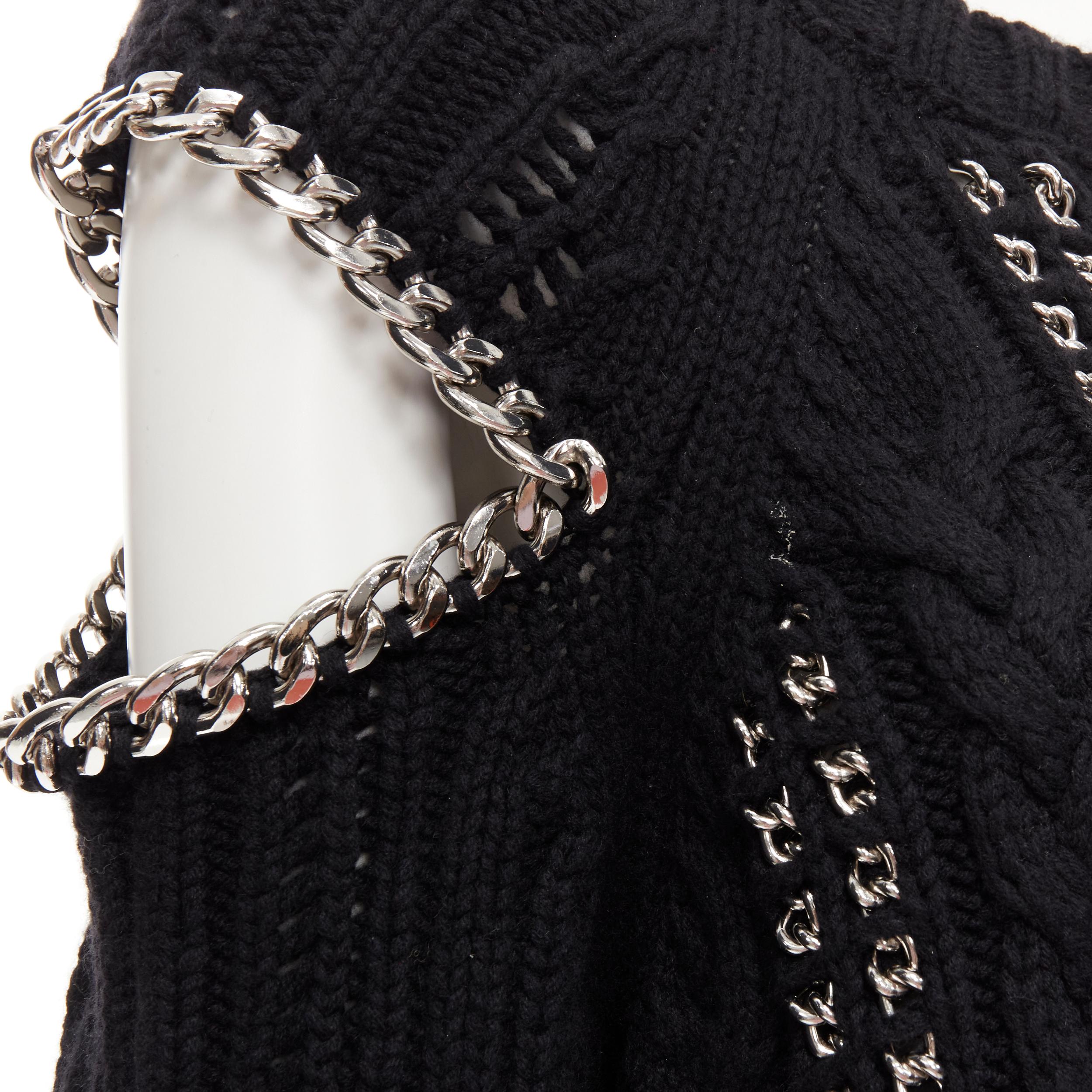 ALEXANDER MCQUEEN 100% cashmere black silver chain cable knit cut out sweater M 
Reference: KEDG/A00075 
Brand: Alexander McQueen 
Designer: Sarah Burton 
Material: Cashmere 
Color: Black 
Pattern: Solid 
Extra Detail: 100% cashmere. Chunky