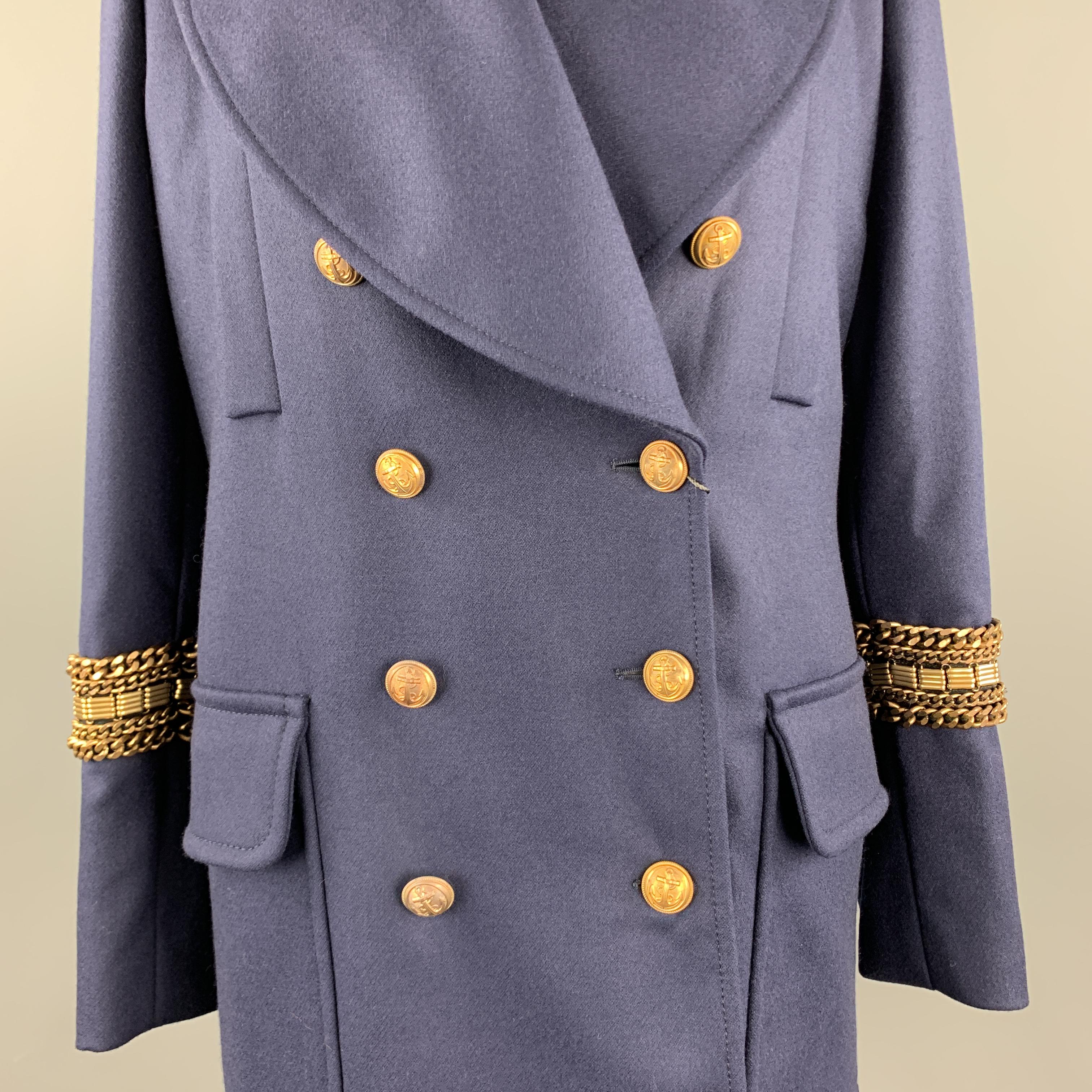 ALEXANDER MCQUEEN nautical pea coat comes in navy blue wool with an oversized peak lapel, double breasted front with brass anchor buttons, epaulets, patch flap pockets, back belt, detachable rabbit fur vest liner, and chain applique stripe cuffs.