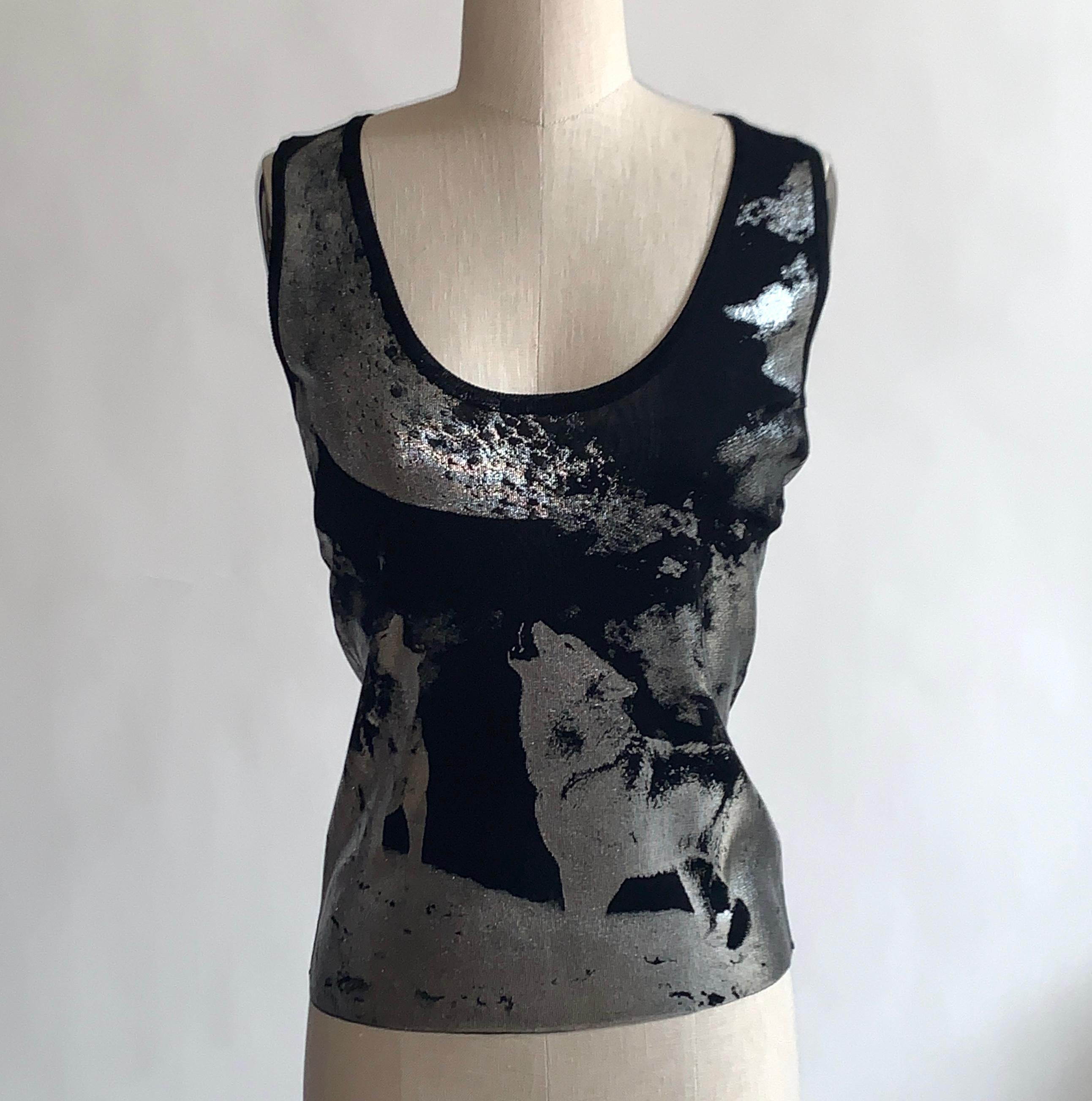 2000s Alexander Mcqueen fine sweater knit sleeveless top with silver howling wolf print throughout. Pull on, no closure. 

100% viscose rayon.

Made in Italy.

Labelled size S, see measurements.
Bust (underarm to underarm) 32