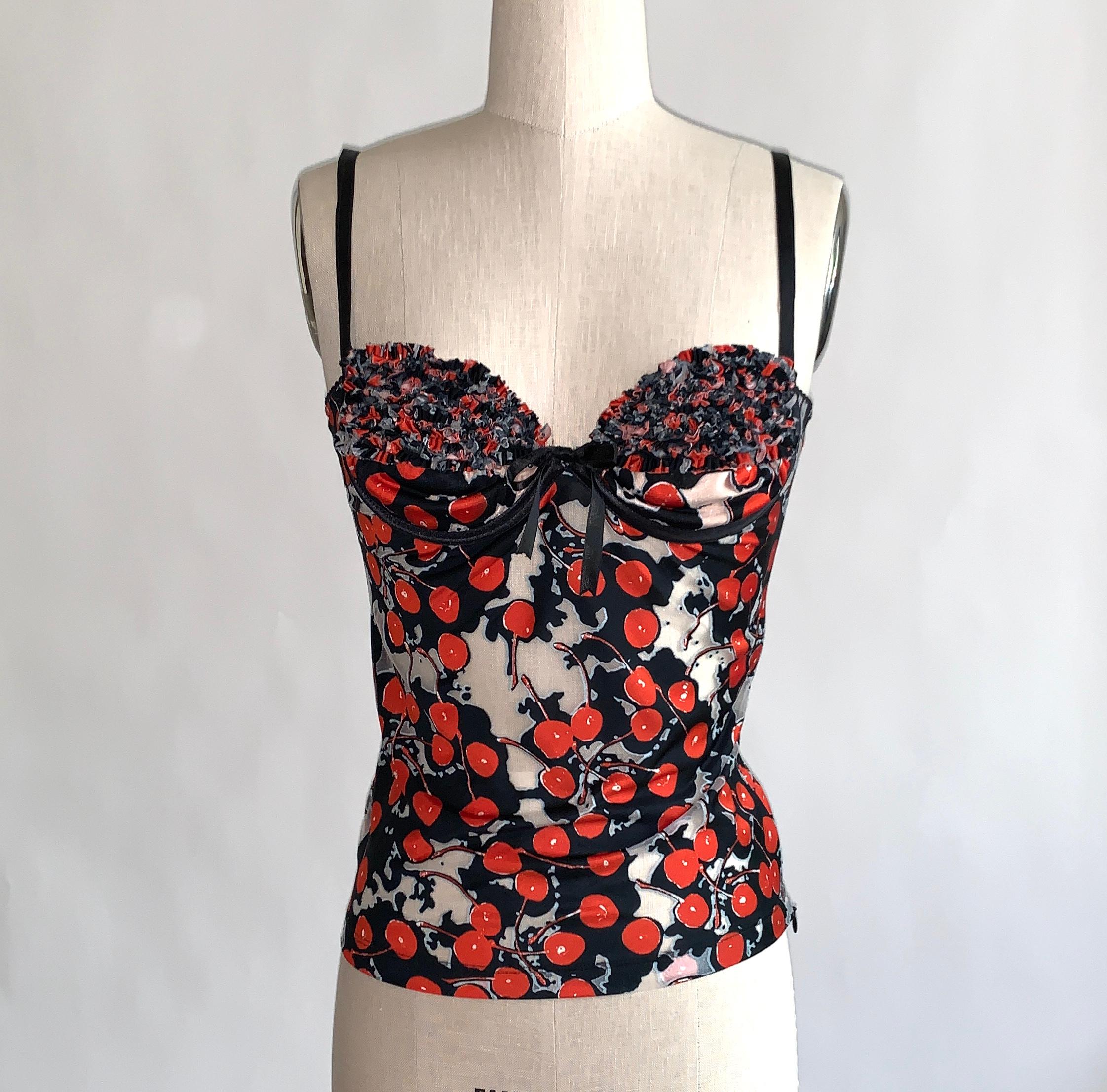 Alexander McQueen S/S 2003 “Irere” black and red cherry print mesh tank top with sheer areas throughout. Intricate pleated ruffle detailing and small black bow at bust. Nude colored lining and underwire at bust, adjustable straps.  Side