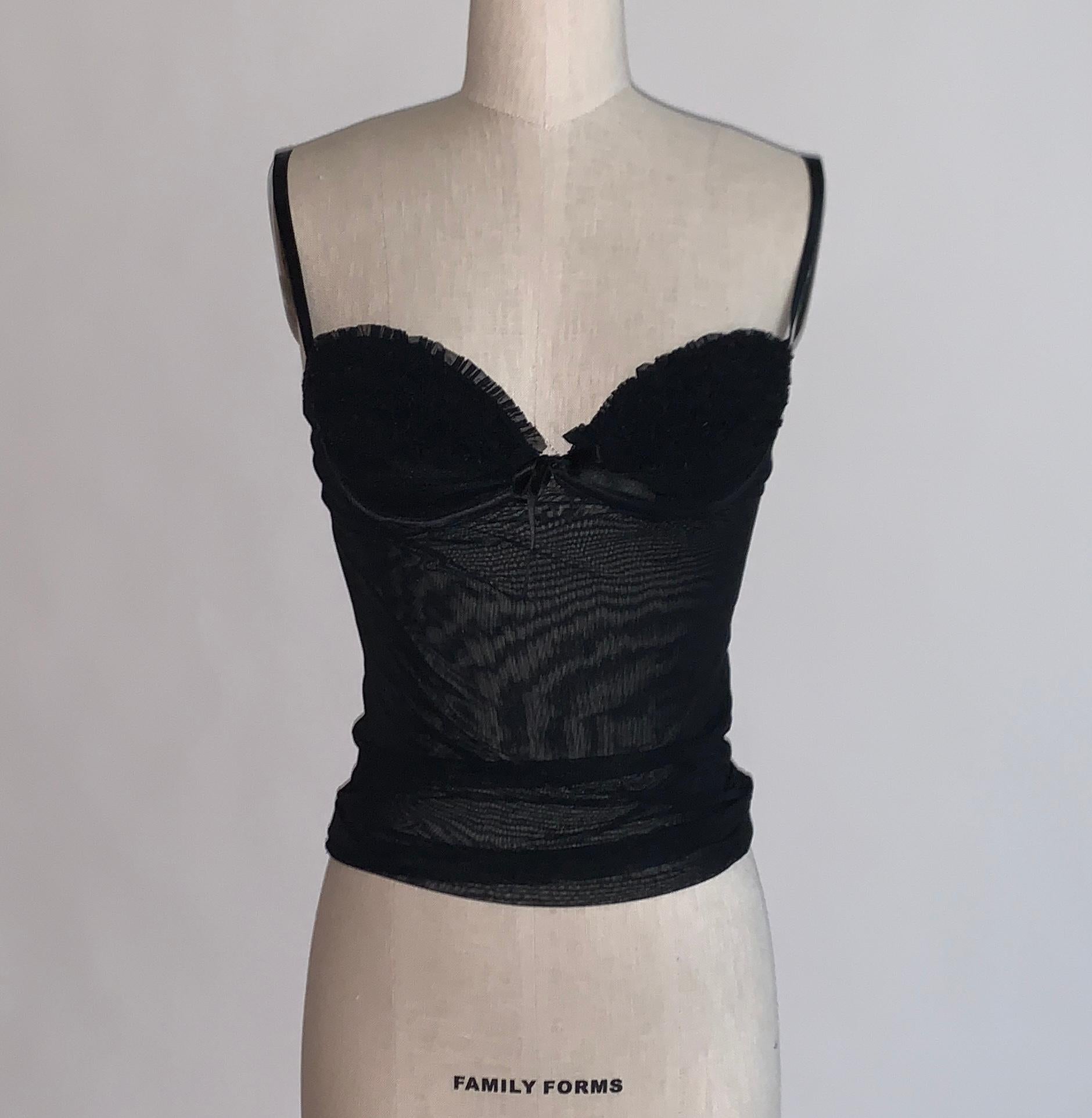 Alexander McQueen 2003 black mesh tank top with intricate black pleated ruffle detailing and small black bow at bust.  Pull on, no closure. Underwire at bust, adjustable straps.

Content tag removed, feels like stretchy synthetic.

Made in