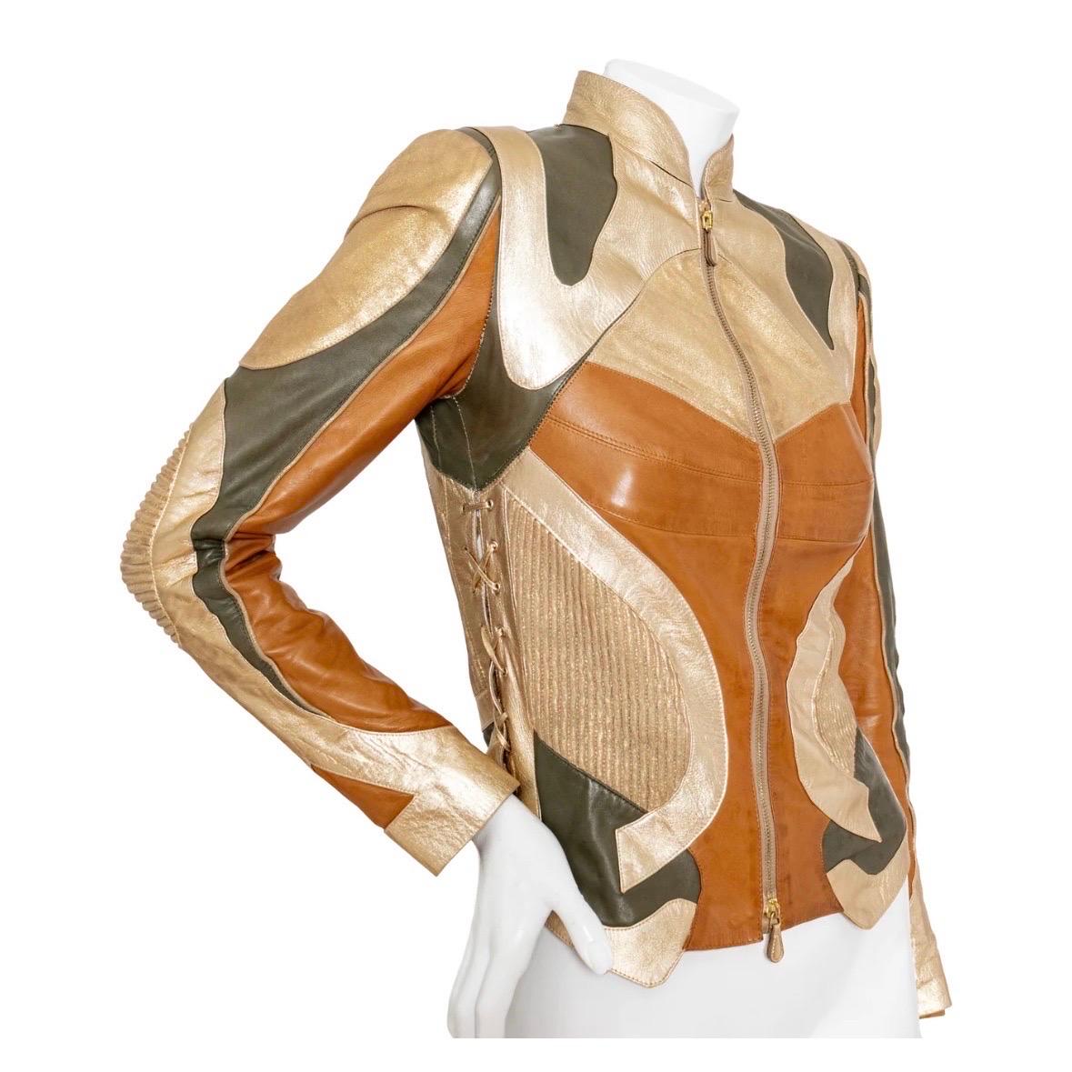 Brown and Gold Patchwork Biker Jacket by Alexander McQueen
Fall 2003 Collection
Multicolored; pearly tan, brown, gold, bronze
Motocross inspired patchwork panels
Gold hardware
Front zip closure; gold-tone zipper with leather pulls
Banded collar
Lace