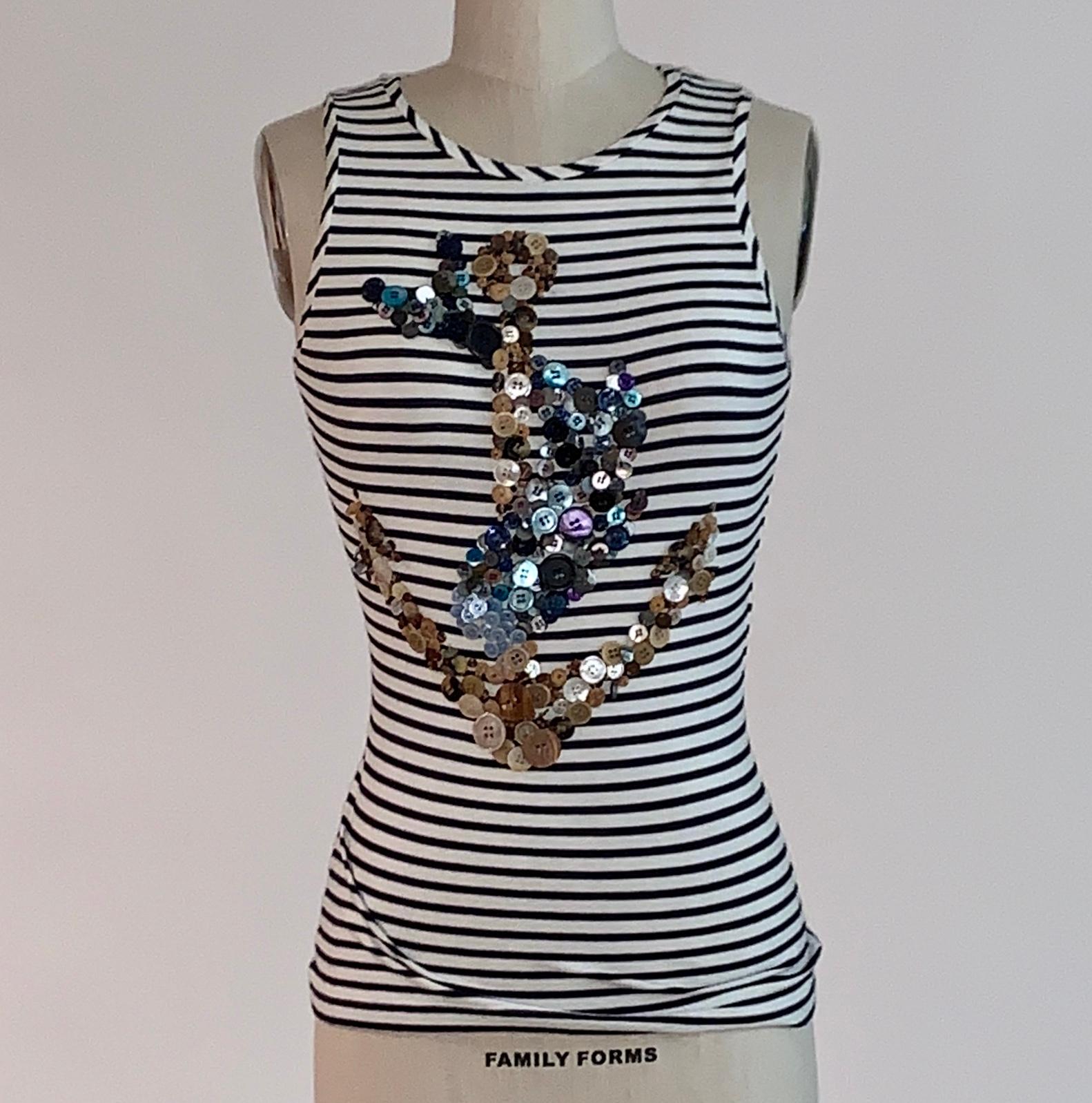 Alexander McQueen 2005 deep navy (almost black) and white stripe tank top with button embellishment forming a fish swimming around an anchor. 

97% rayon, 3 % spandex.

Made in Italy.

Size IT 38, approximate US 2. Seen on size 2 dress form. 
Very