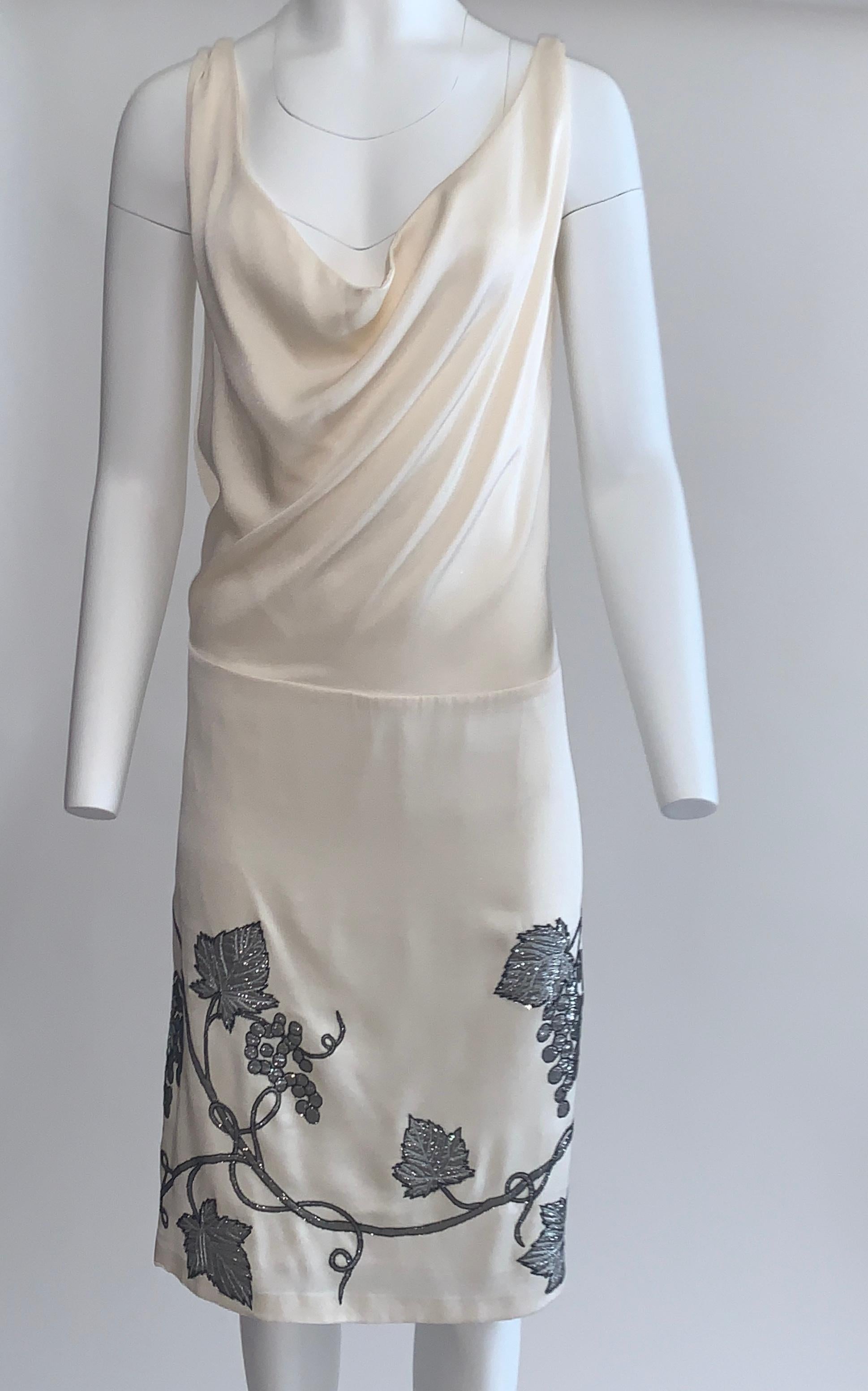 Rare Alexander McQueen cream silk dress with draped cowl neck and silver grape appliqué. Stunning back detail with deep scoop and ruching at center.  No closure, pull on. A truly iconic McQueen piece! 

100% silk.
Fully lined in 100% silk.

Made in