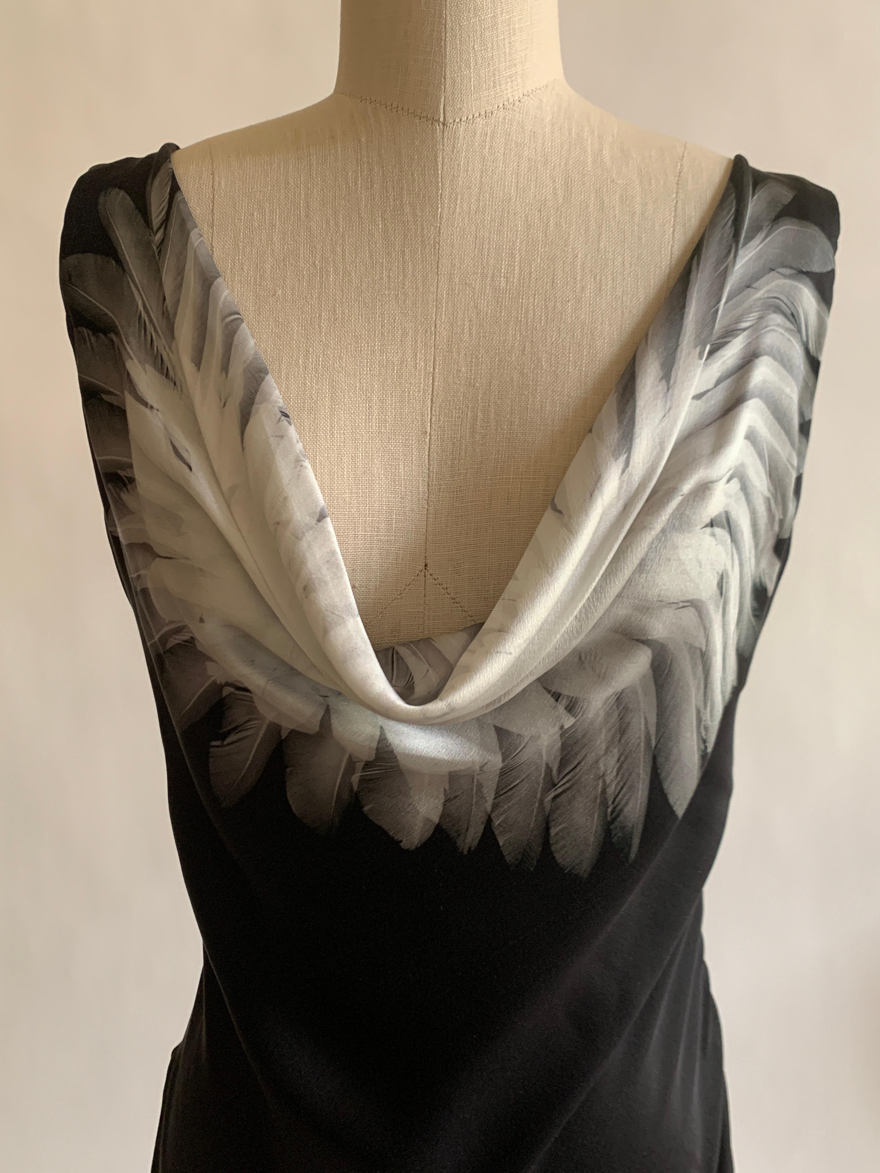 Alexander McQueen black silk bias cut dress with cowl neck featuring grey feather print. Side zip with hook and loop closure.

100% silk.
Fully lined in 74% acetate, 26% silk.

Made in Italy. 

Size IT 38, approximate US 2. See measurements.
Bust