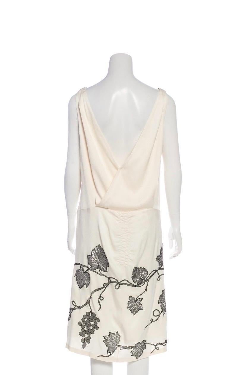 2007 Vintage Alexander McQueen GREEK GODDESS Silk Dress with Grape Appliqué 
It size 44 - US 8
Champagne Color, Finished with Metallic Gray Appliqué, Ruched Detail, Pull-On Style.
Composition: 100% Silk, Lining 100% Silk.
Measurements: Length 42