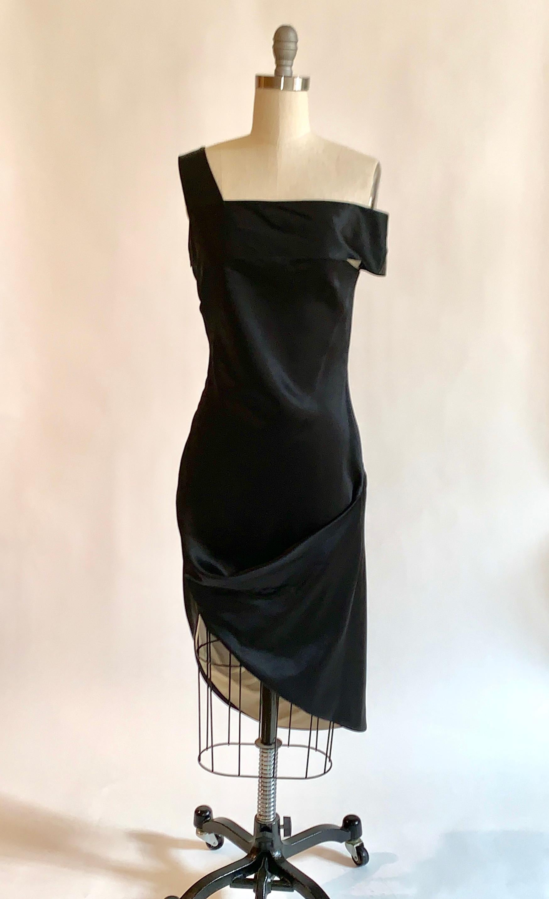 Alexander McQueen black and nude silk dress with asymmetrical neckline (one strap falls just off the shoulder) and drape at skirt from his 2008 collection. Back of skirt is just longer than the front, so that it shows a flash of nude lining when