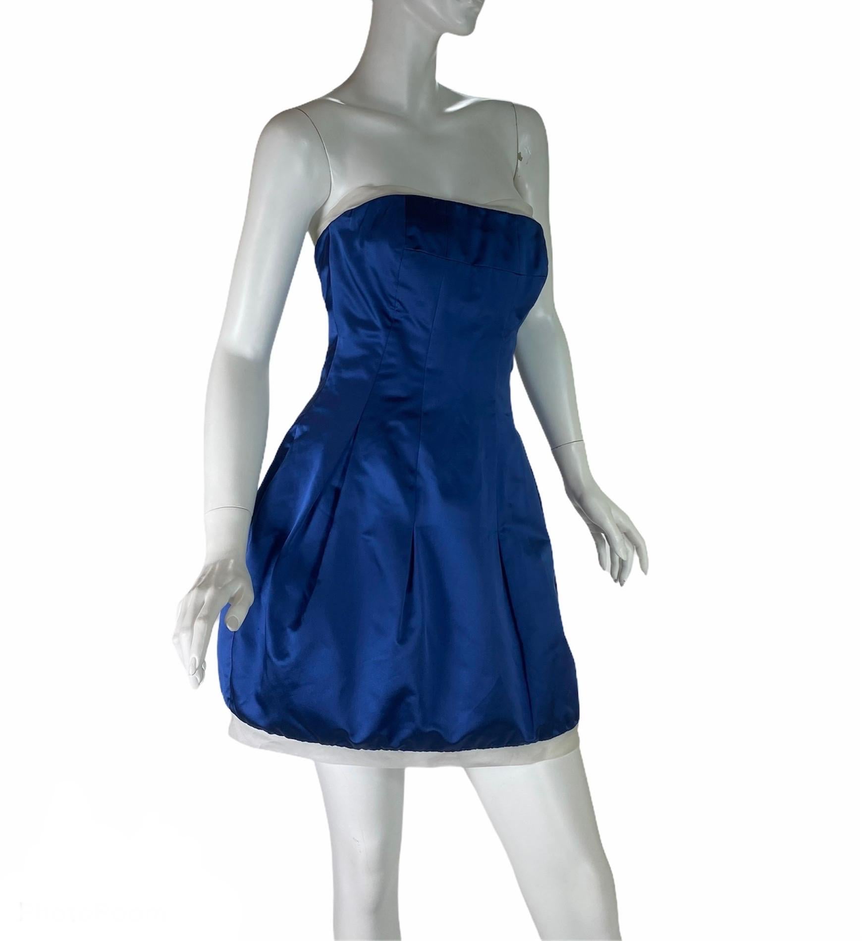 Alexander McQueen Silk Blue Mini Dress
2008 Collection
Italian size 40
100% Silk, Inner Corset, Pleated Skirt, White Trim, Fully Lined, Back Zip Closure.
Measurements: Length - 25 inches ( under the arm and down), Bust - 32/33