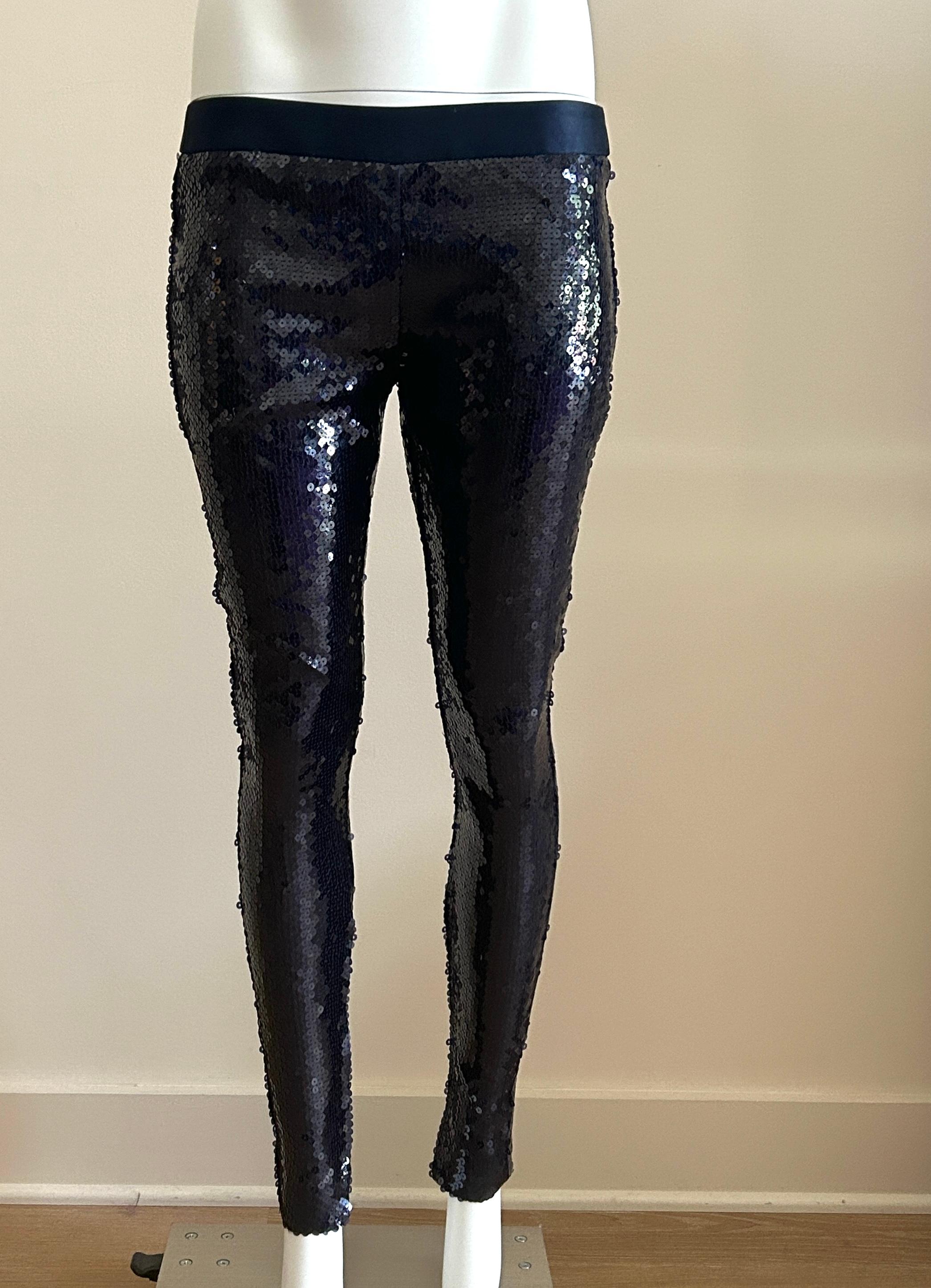 Alexander McQueen navy blue sequined leggings from the Fall/Winter 2008 collection The Girl Who Lived in a Tree. As seen in gold in runway look 25.

Pants feature all over navy blue metallic sequins with zippers at inner ankles for tailored fit.
