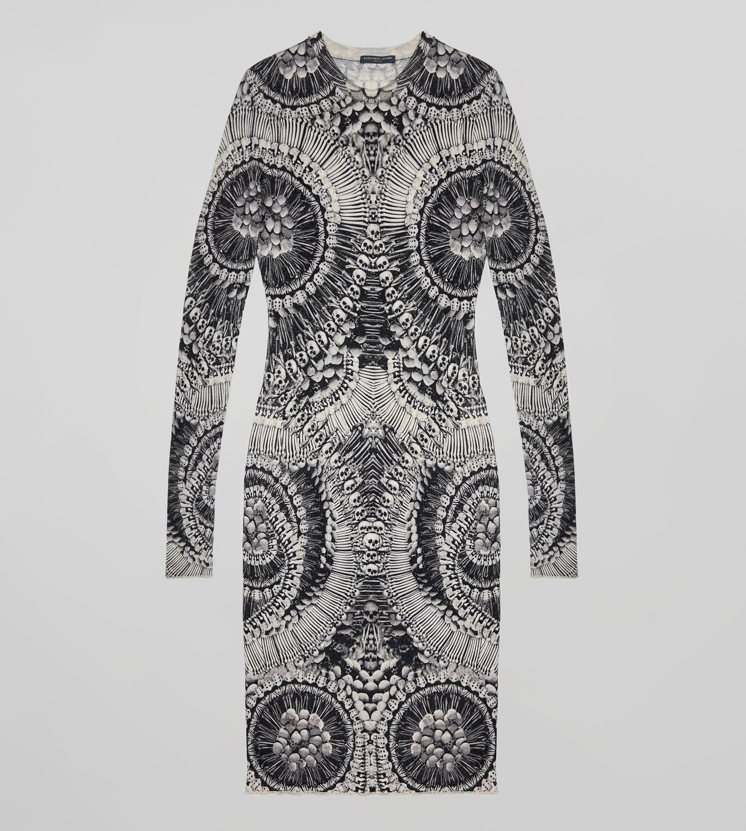Trendy and extremely iconic, we all lust over this Alexander McQueen skull print dress. This gorgeous long sleeve dress features a black and white repeat skull print in a ultra soft blend of wool and silk. This dress is perfect for wearing from day