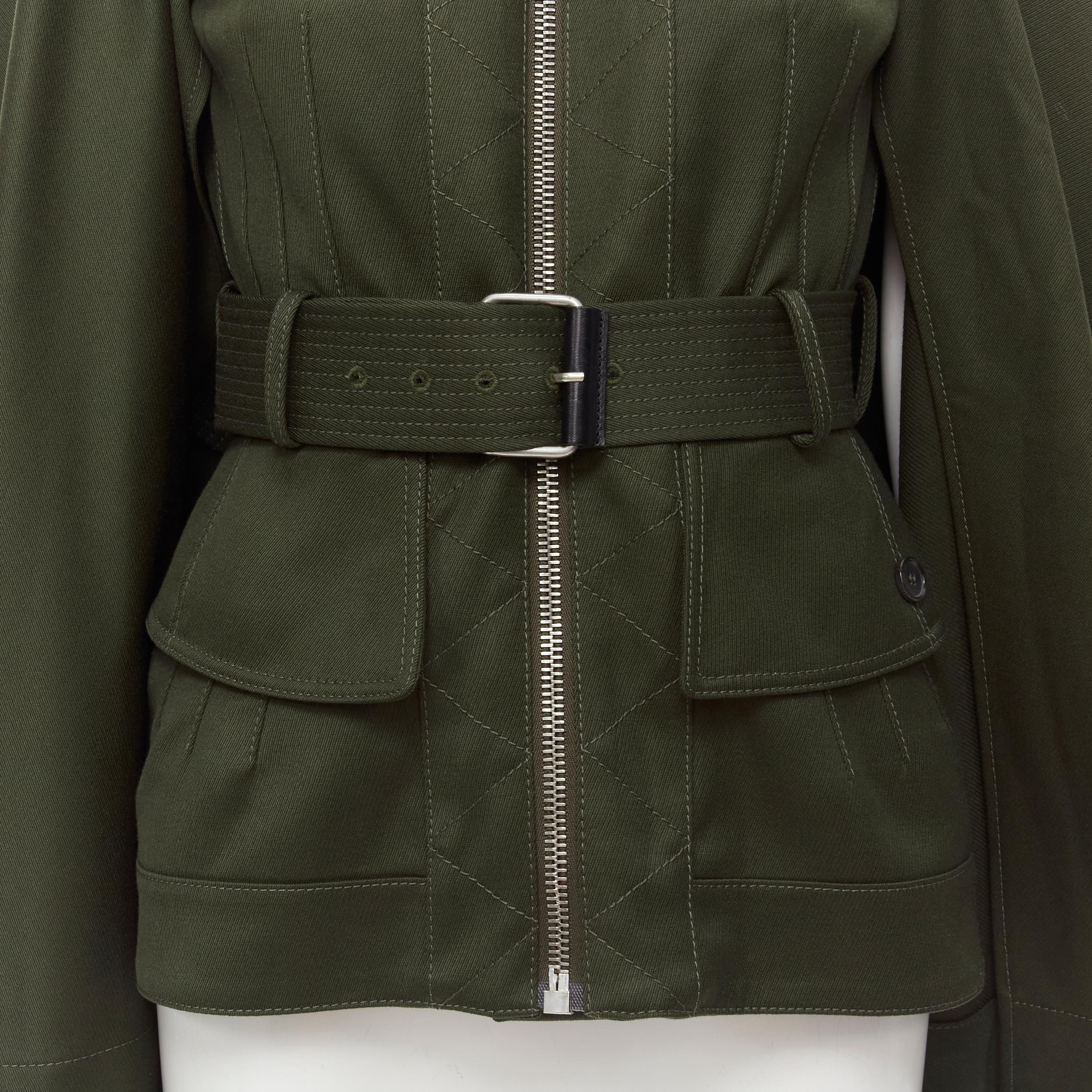ALEXANDER MCQUEEN 2015 khaki green belted military cape jacket IT38 S 
Reference: KEDG/A00029 
Brand: Alexander McQueen 
Designer: Sarah Burton 
Collection: 2015 
Material: Cotton 
Color: Green 
Pattern: Solid 
Closure: Zip 
Extra Detail: Removable